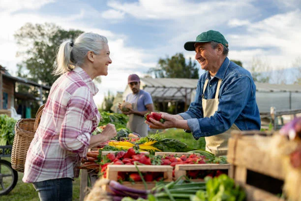 Farmers market with fresh produce and smiling vendors