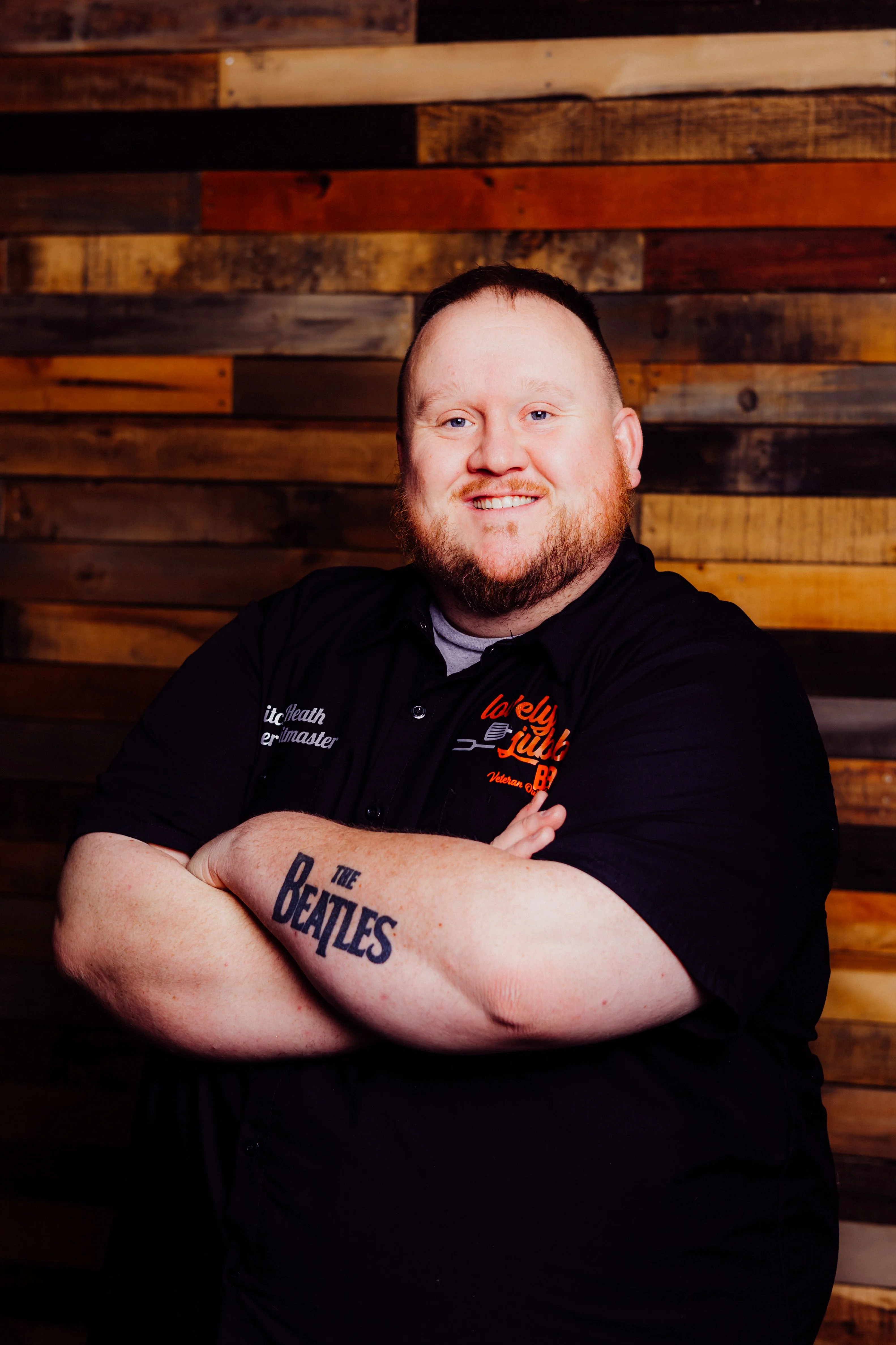Chef posing confidently in a rustic restaurant setting