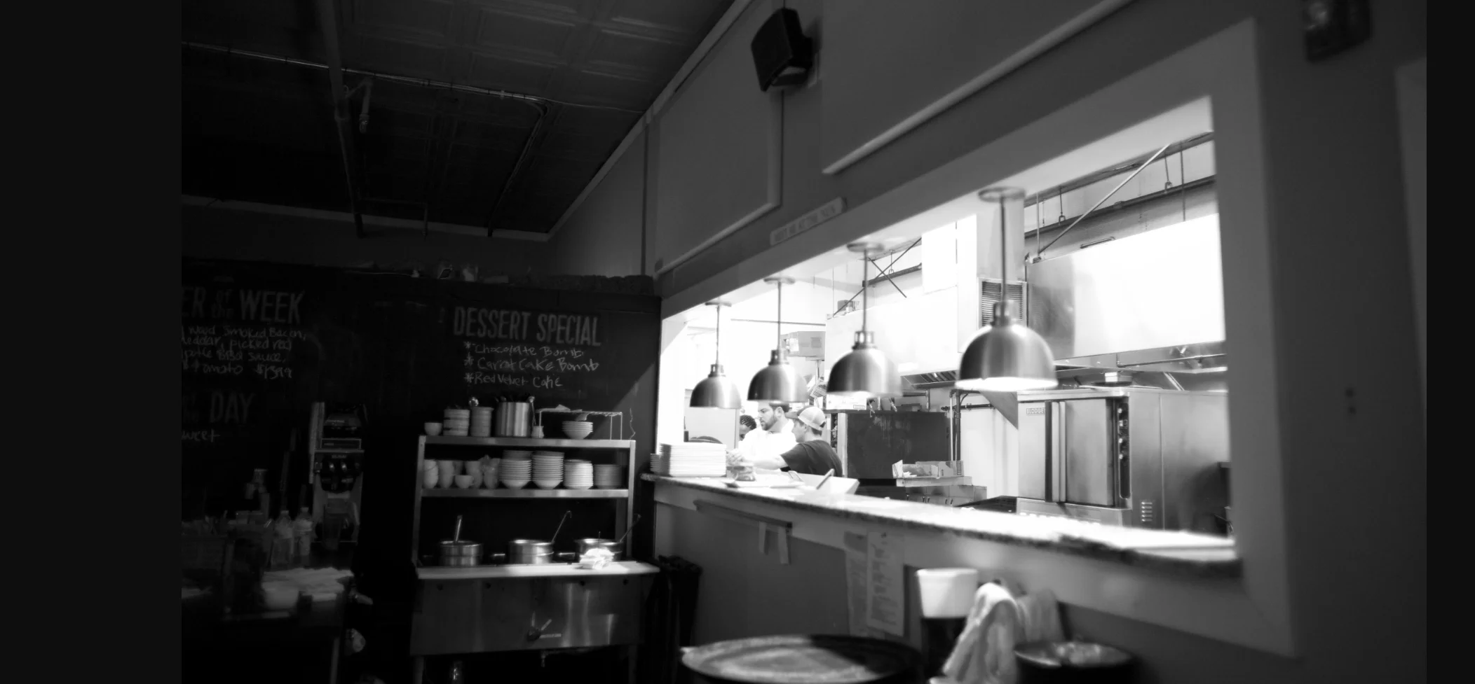 Cozy restaurant kitchen with dessert specials on chalkboard