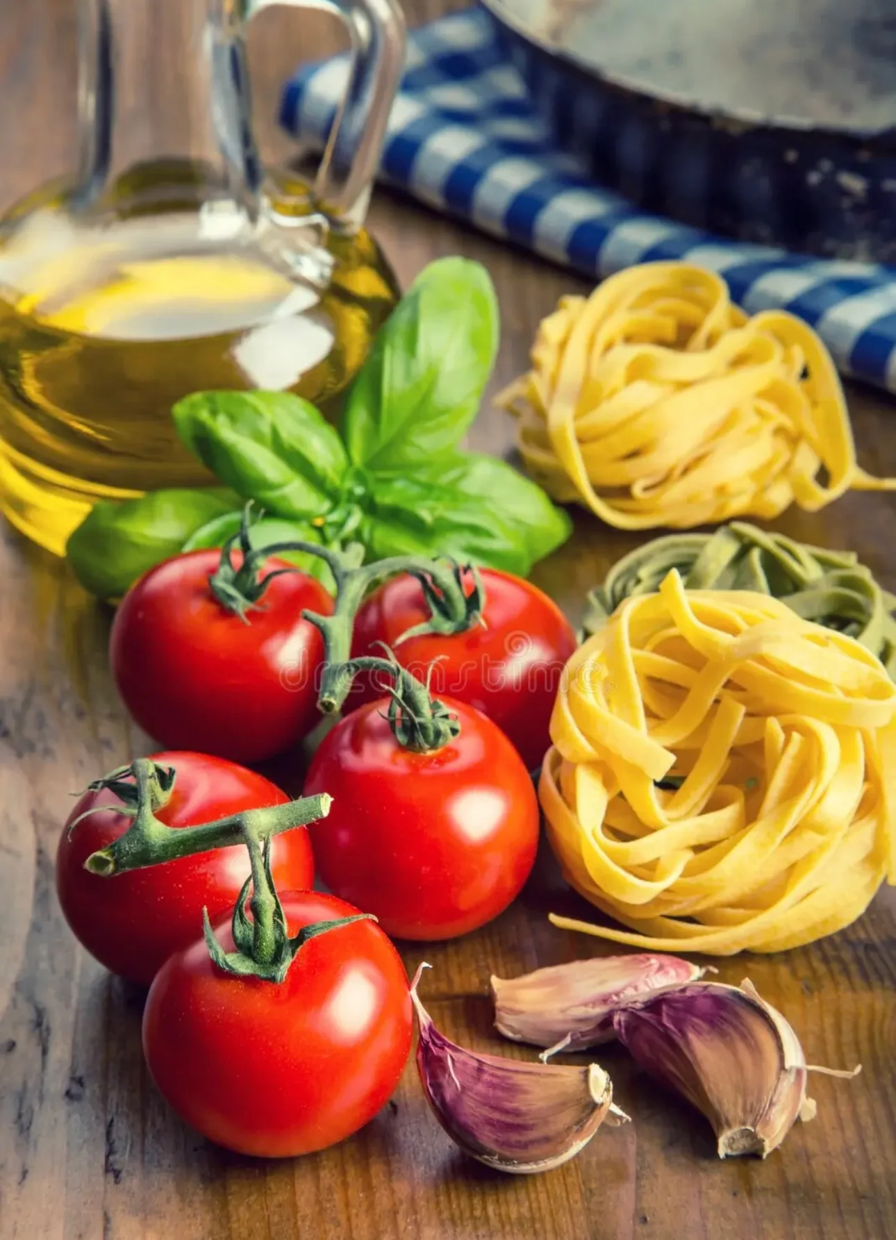 Fresh ingredients for Italian pasta dish with tomatoes and basil