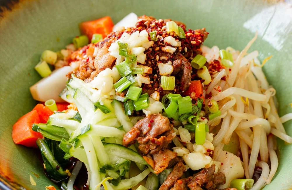 Spicy Thai salad with grilled meat and fresh vegetables