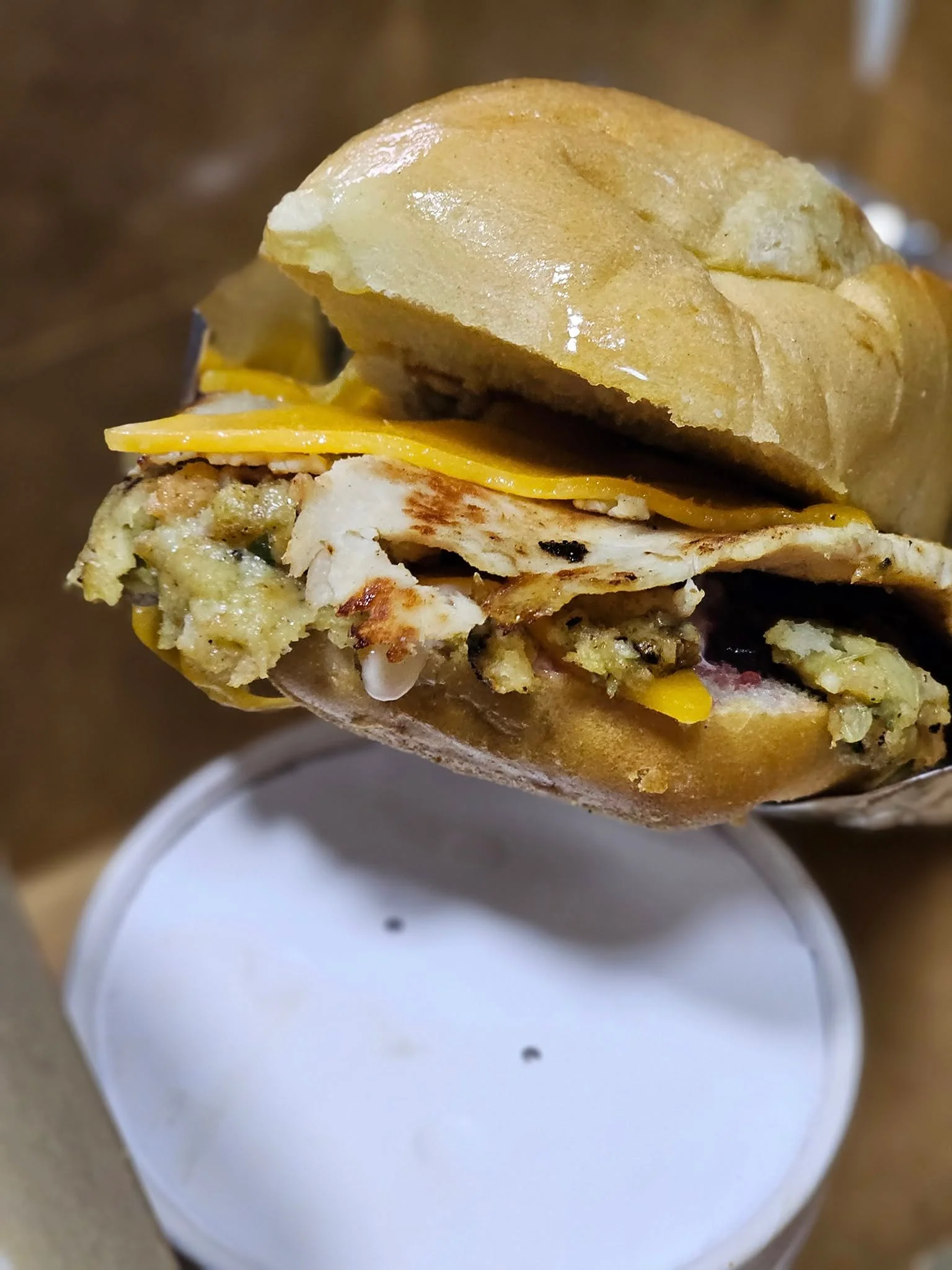 Savory chicken sandwich with stuffing and cheddar cheese