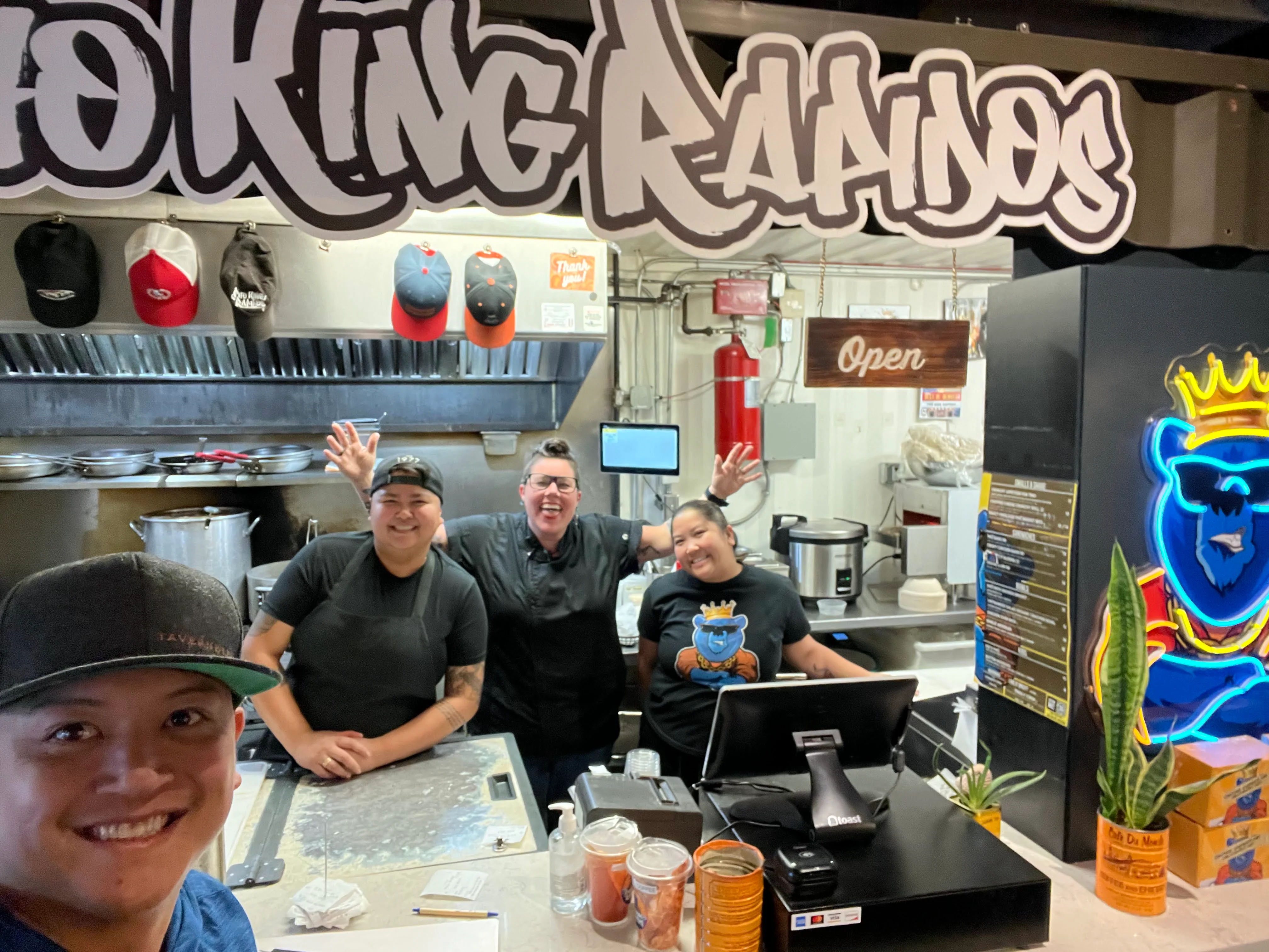 Friendly staff at a vibrant restaurant counter