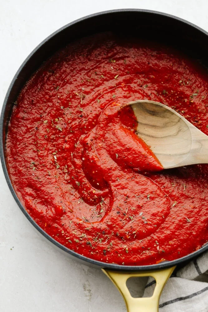 Rich marinara sauce simmering in a skillet
