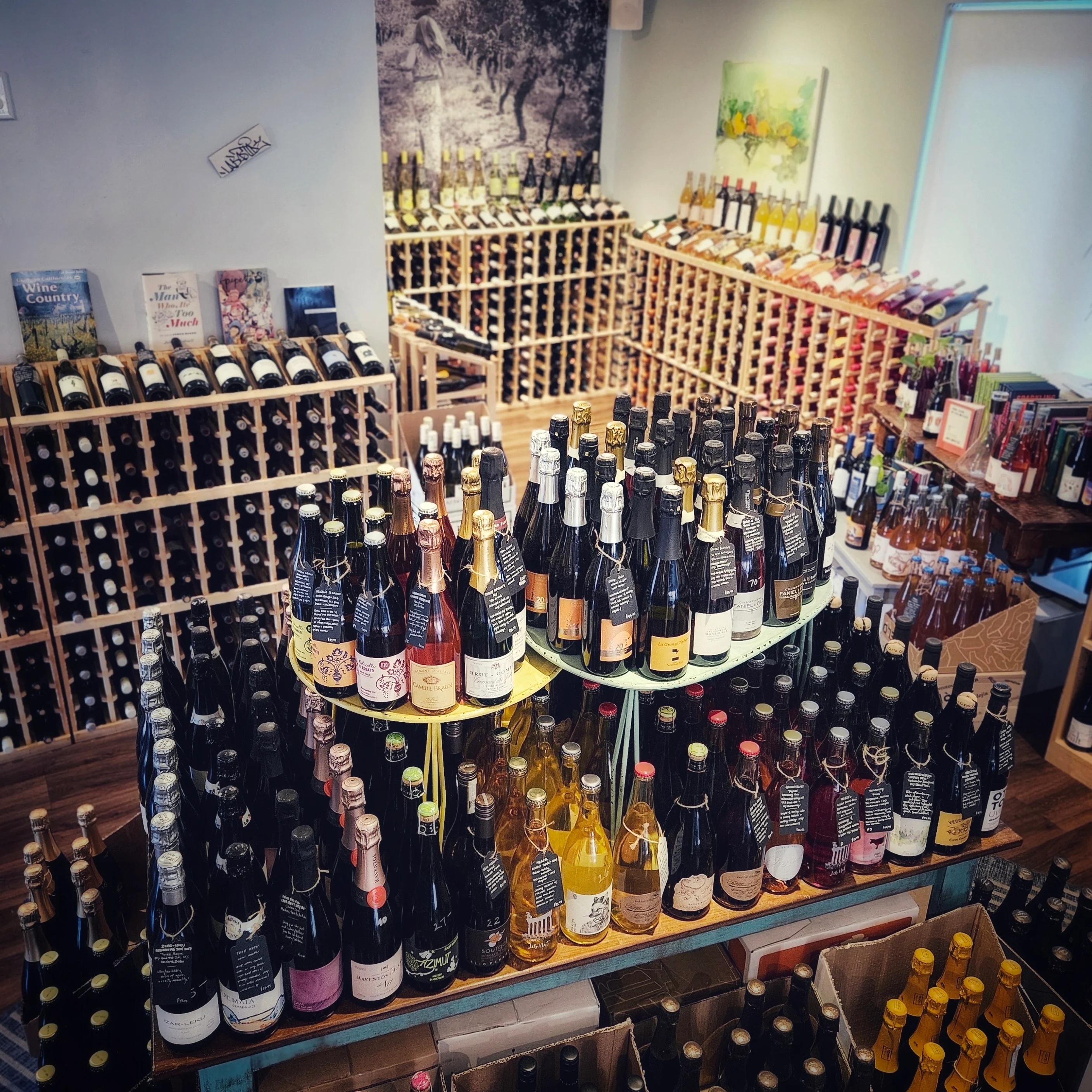 Wine shop interior with diverse bottles and wooden racks