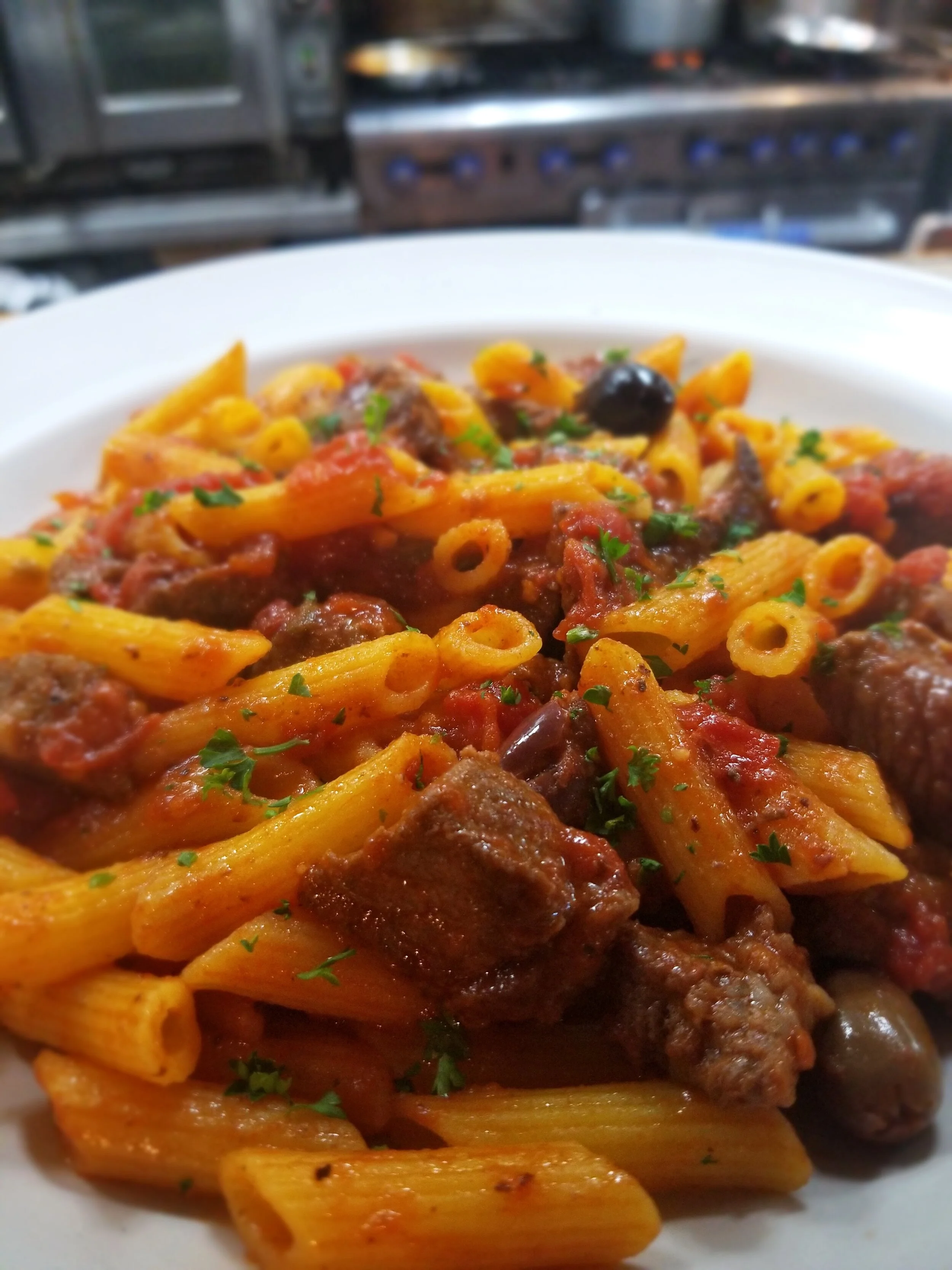 Italian pasta dish with beef and tomato sauce