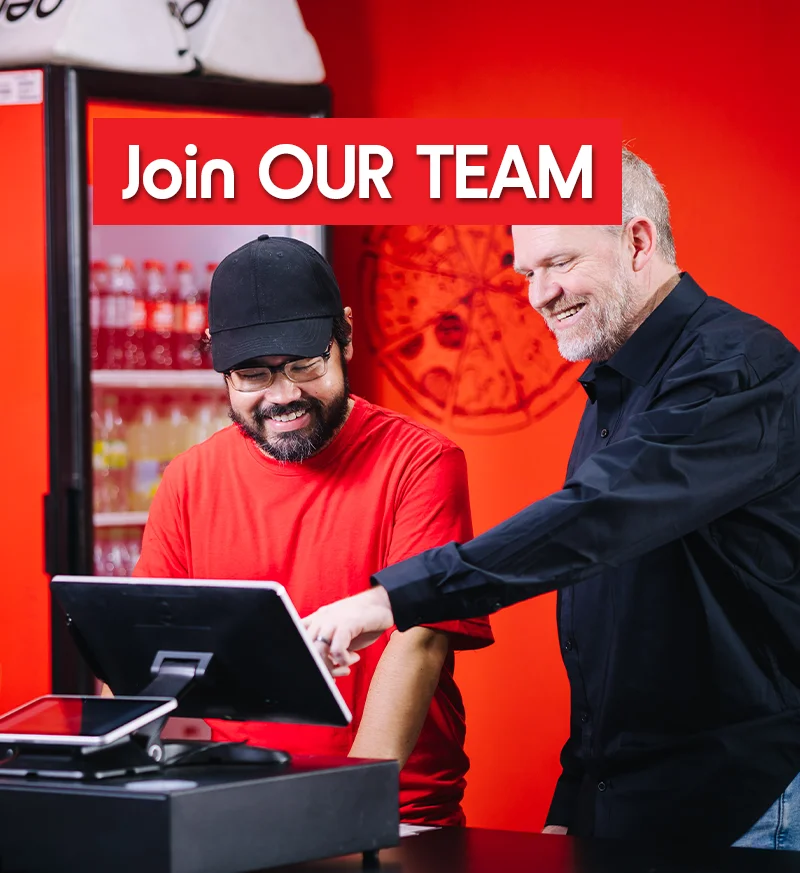 Team members collaborating at a restaurant counter