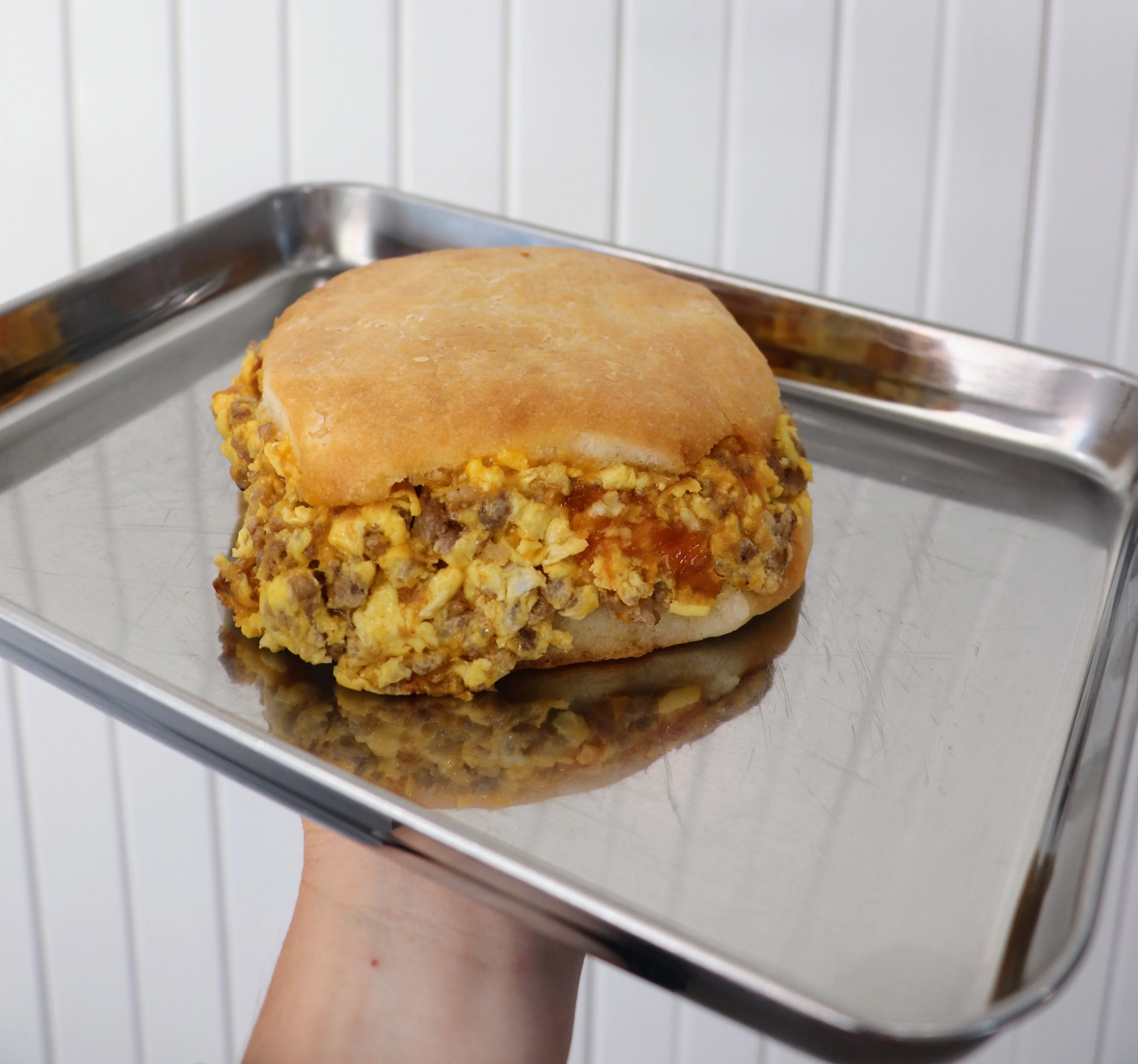 Breakfast sandwich with scrambled eggs and sausage