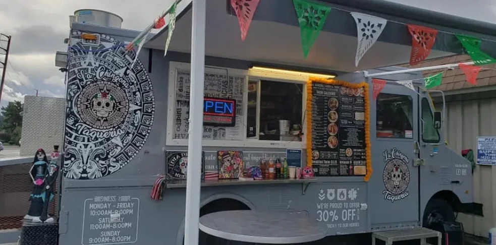 Colorful food truck serving authentic Mexican tacos