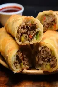Crispy beef spring rolls with dipping sauce