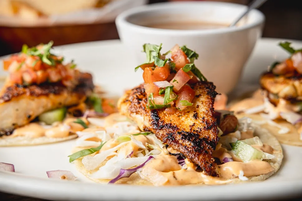 Grilled fish tacos topped with fresh salsa