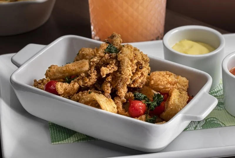 Crispy calamari with cherry tomatoes and herbs