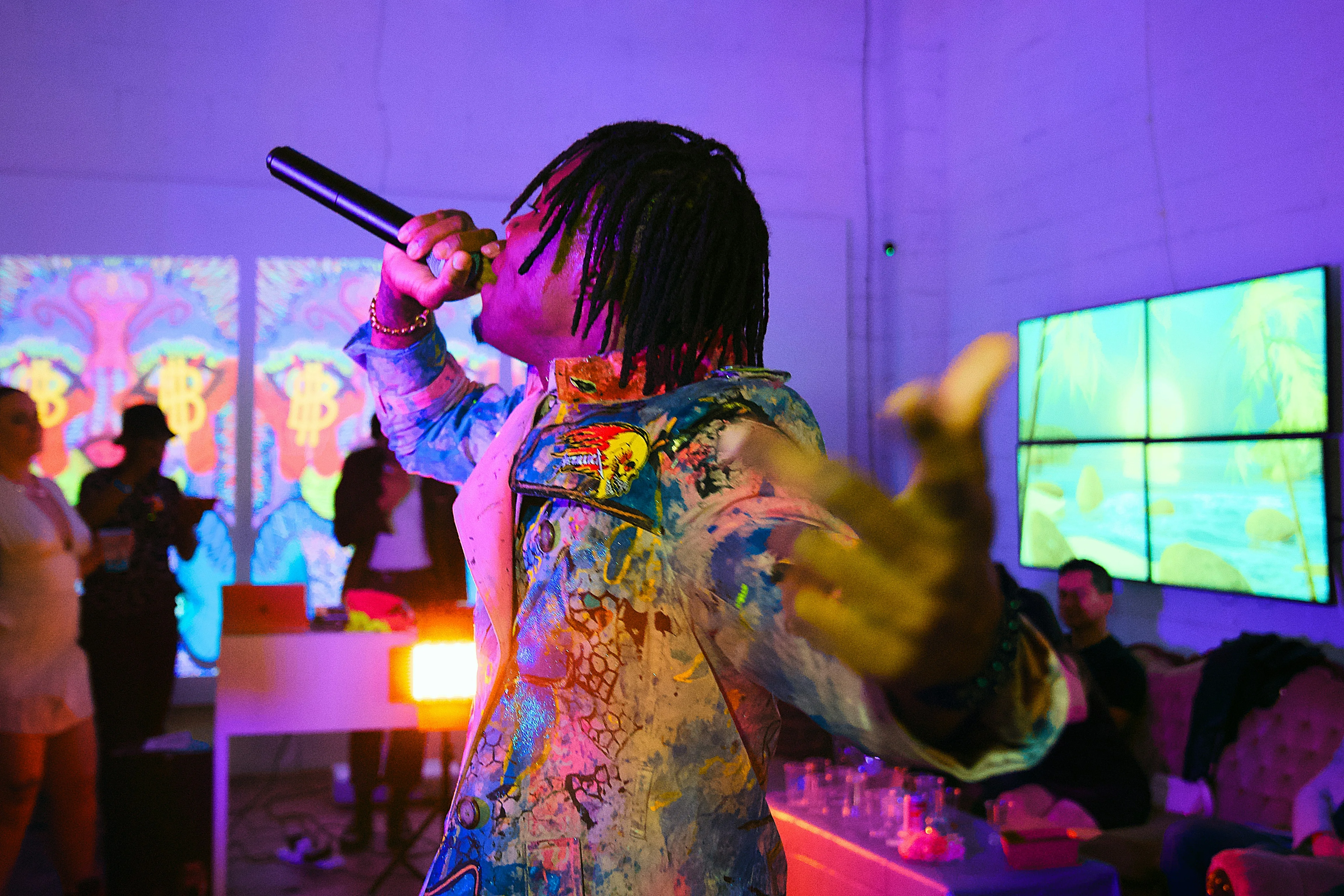 Live performance with vibrant lighting and energetic atmosphere