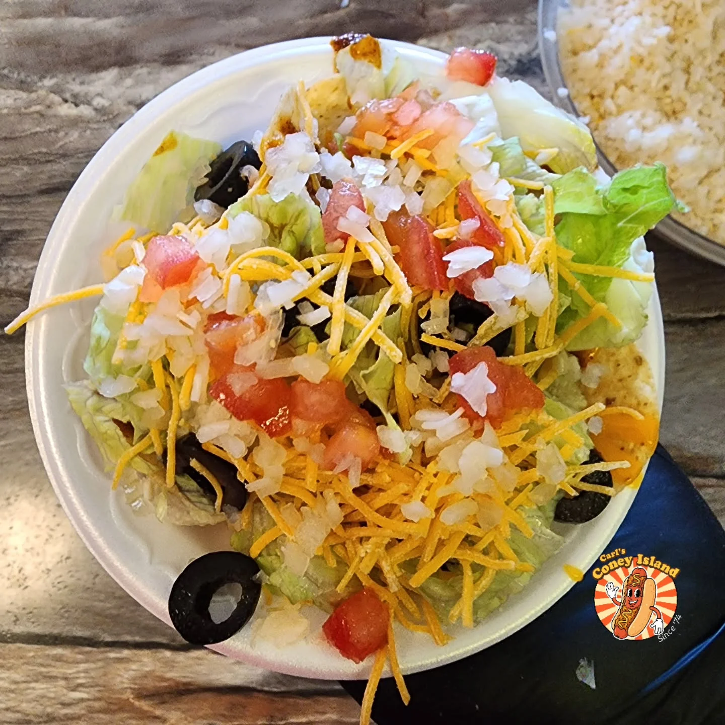Fresh taco salad with lettuce, cheese, and toppings
