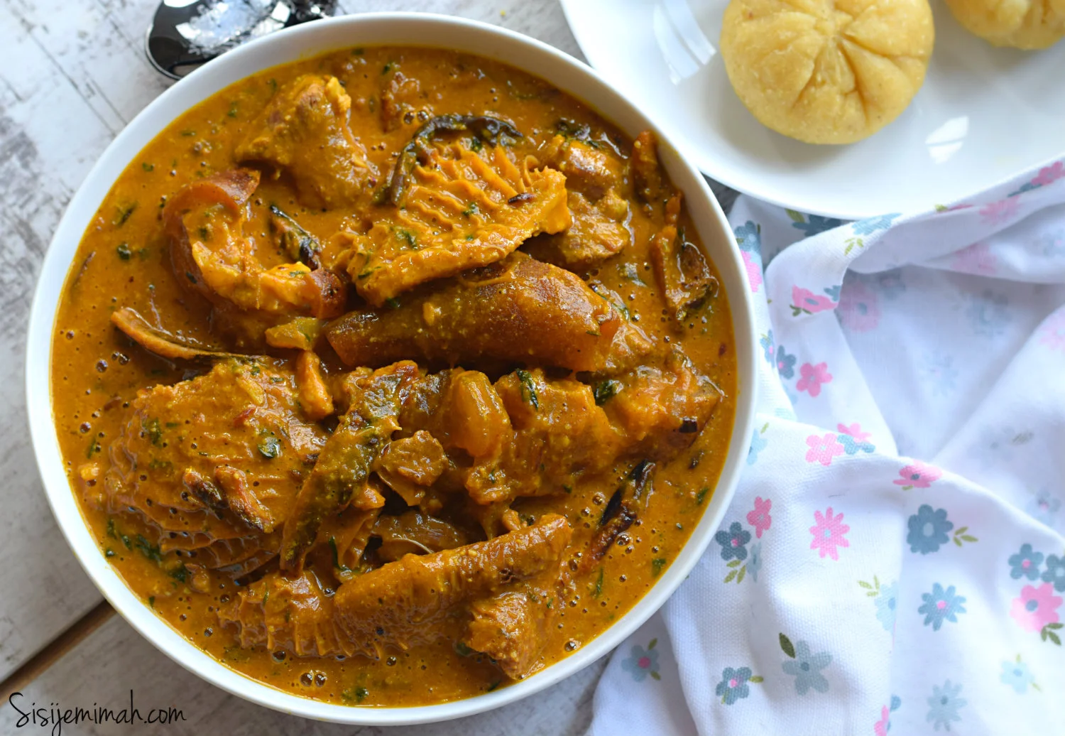 Nigerian egusi soup served with pounded yam