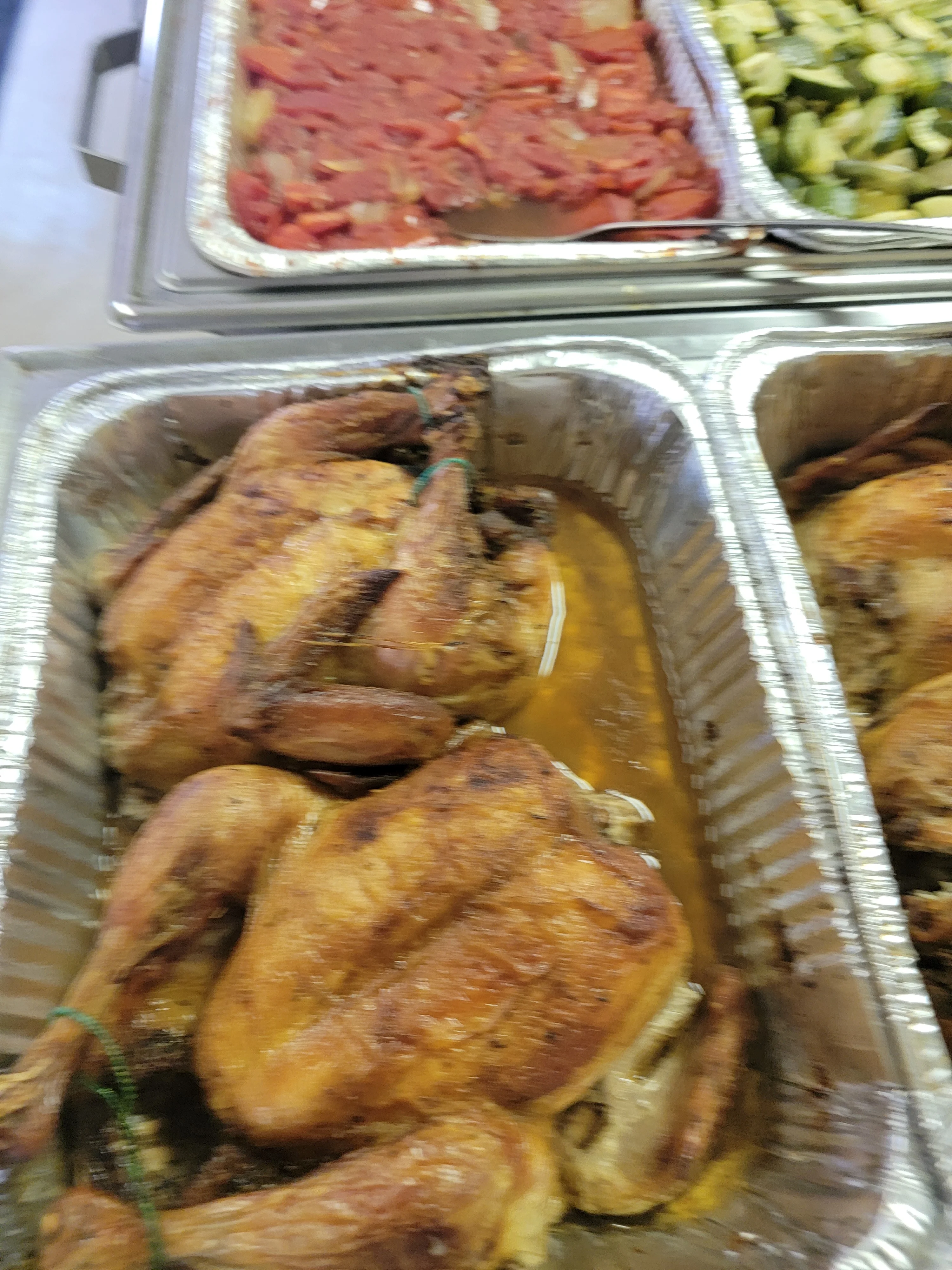 Roasted whole chickens served with sides