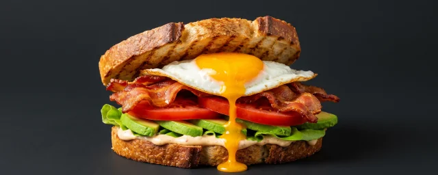 Classic breakfast sandwich with bacon and egg