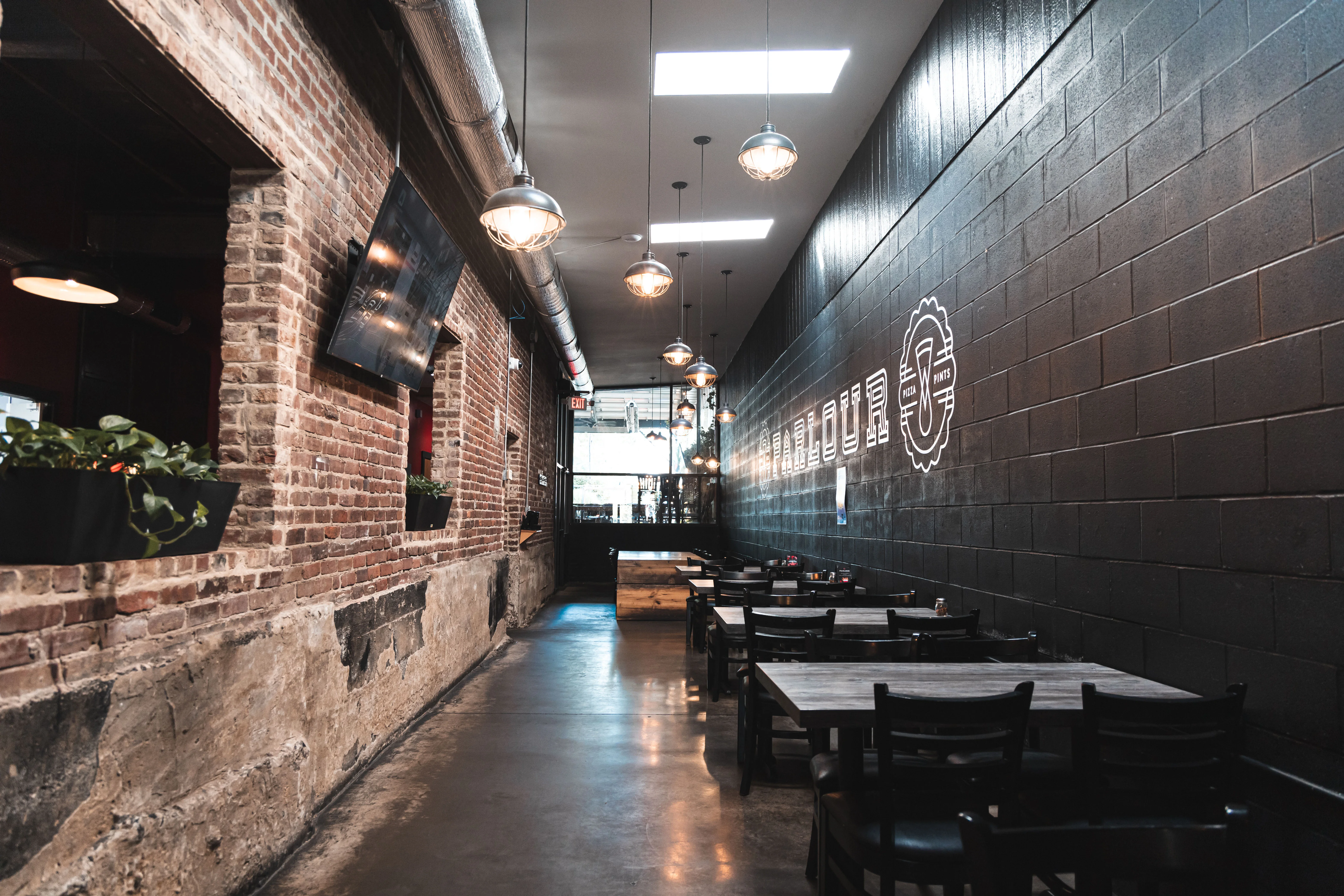 Cozy restaurant interior with exposed brick and modern lighting