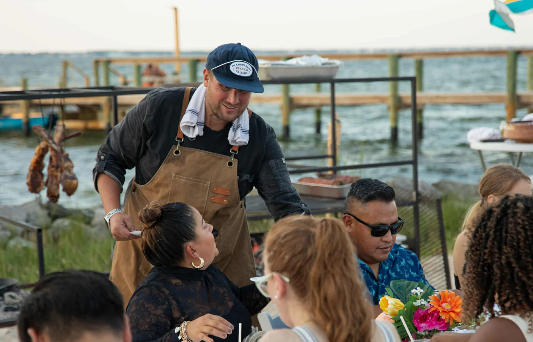 Chef serving food at dinner event