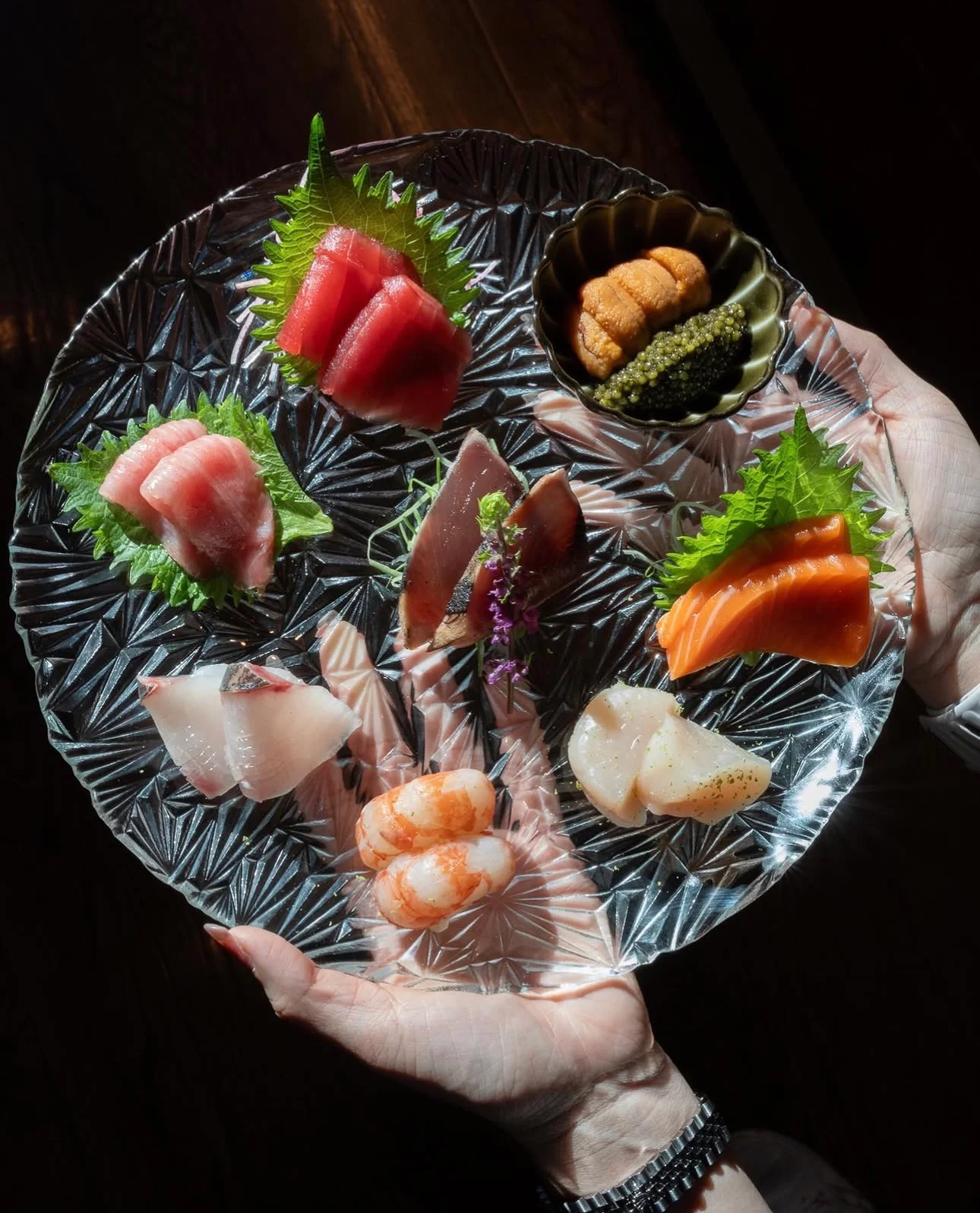 Artfully arranged Japanese sashimi platter with fresh seafood