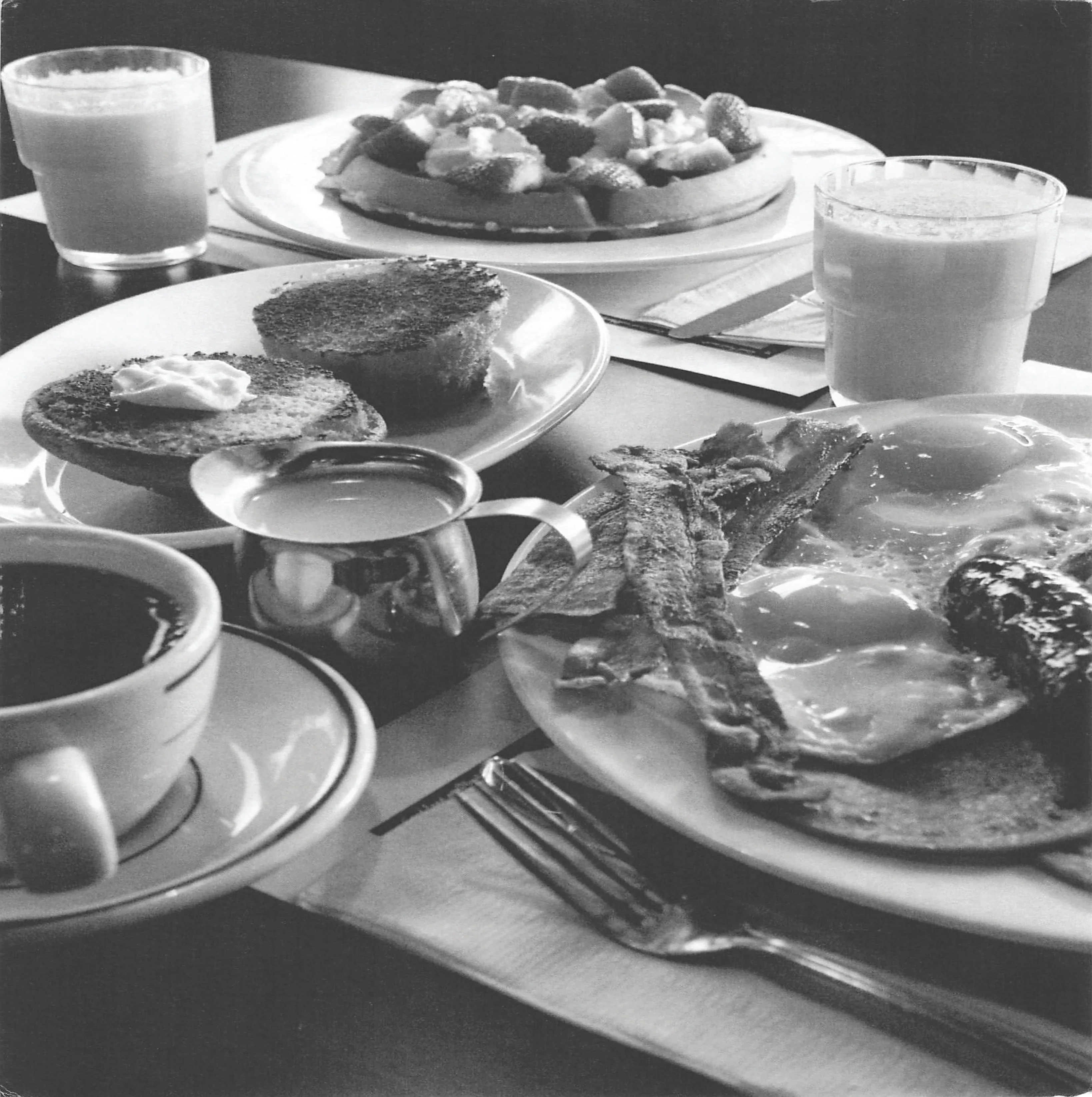 Classic American breakfast with eggs, bacon, and toast