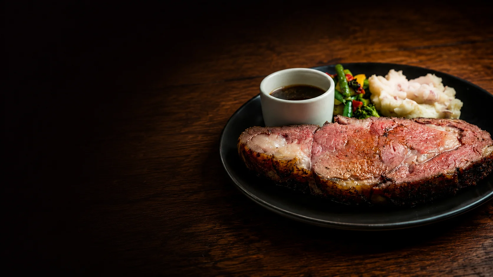 Prime rib dinner at The Deck Down Under in Jerome Michigan with hand-cut beef, au jus, potato, and seasonal vegetable