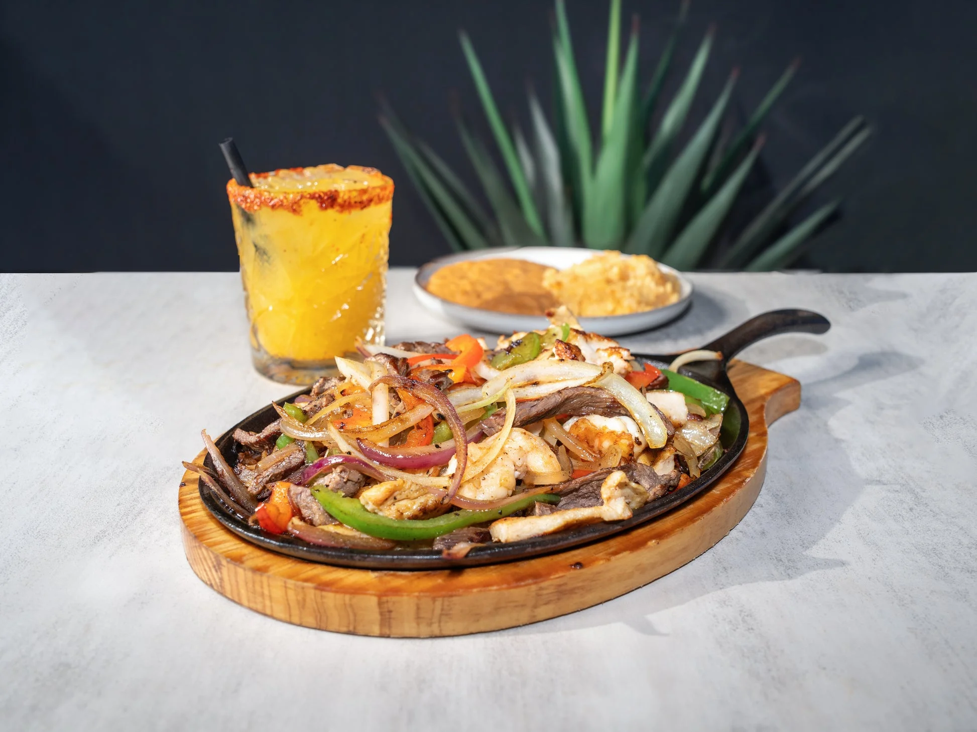 Sizzling fajitas served on a hot skillet
