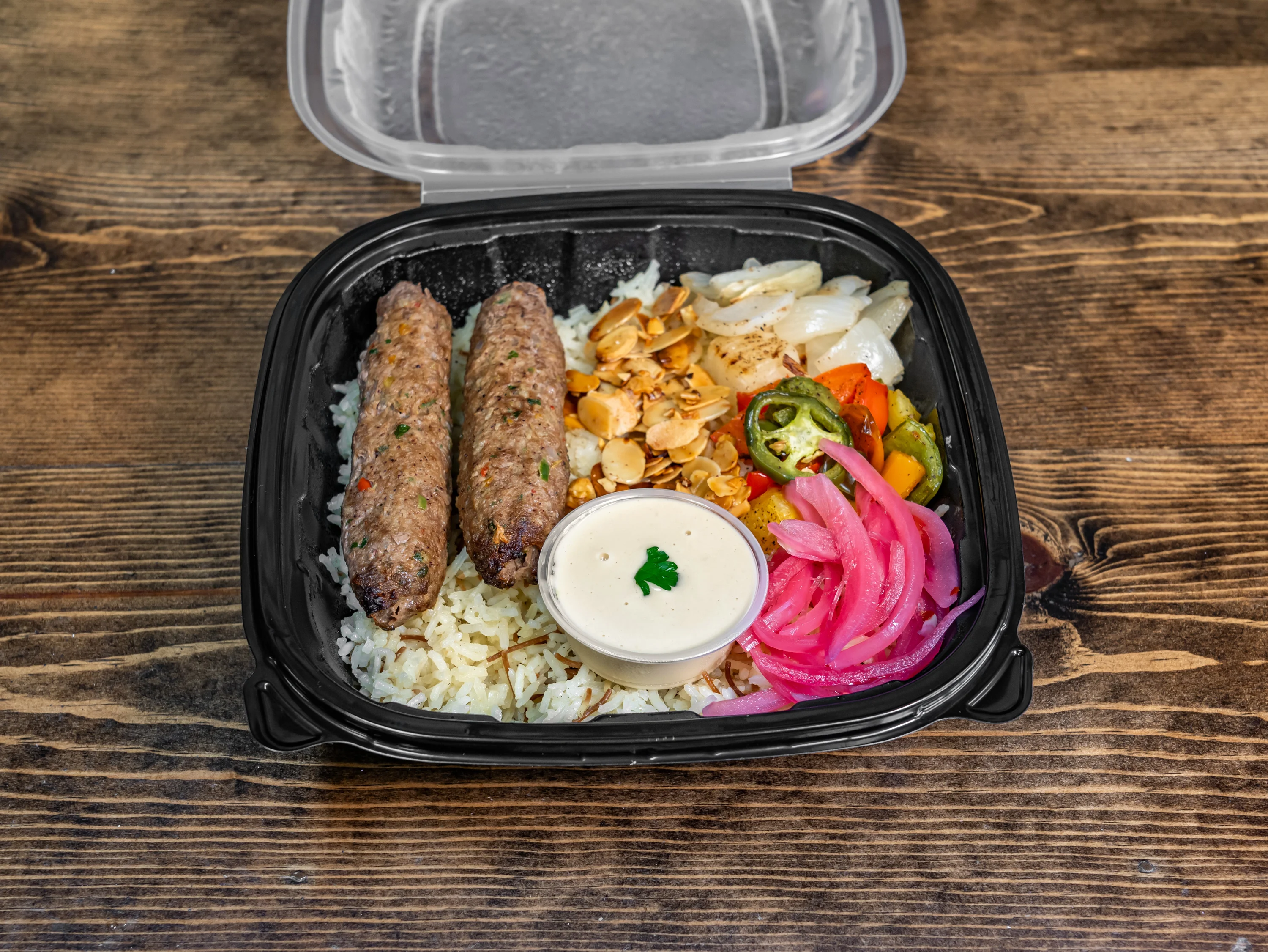 Middle Eastern kebab platter with rice and vegetables