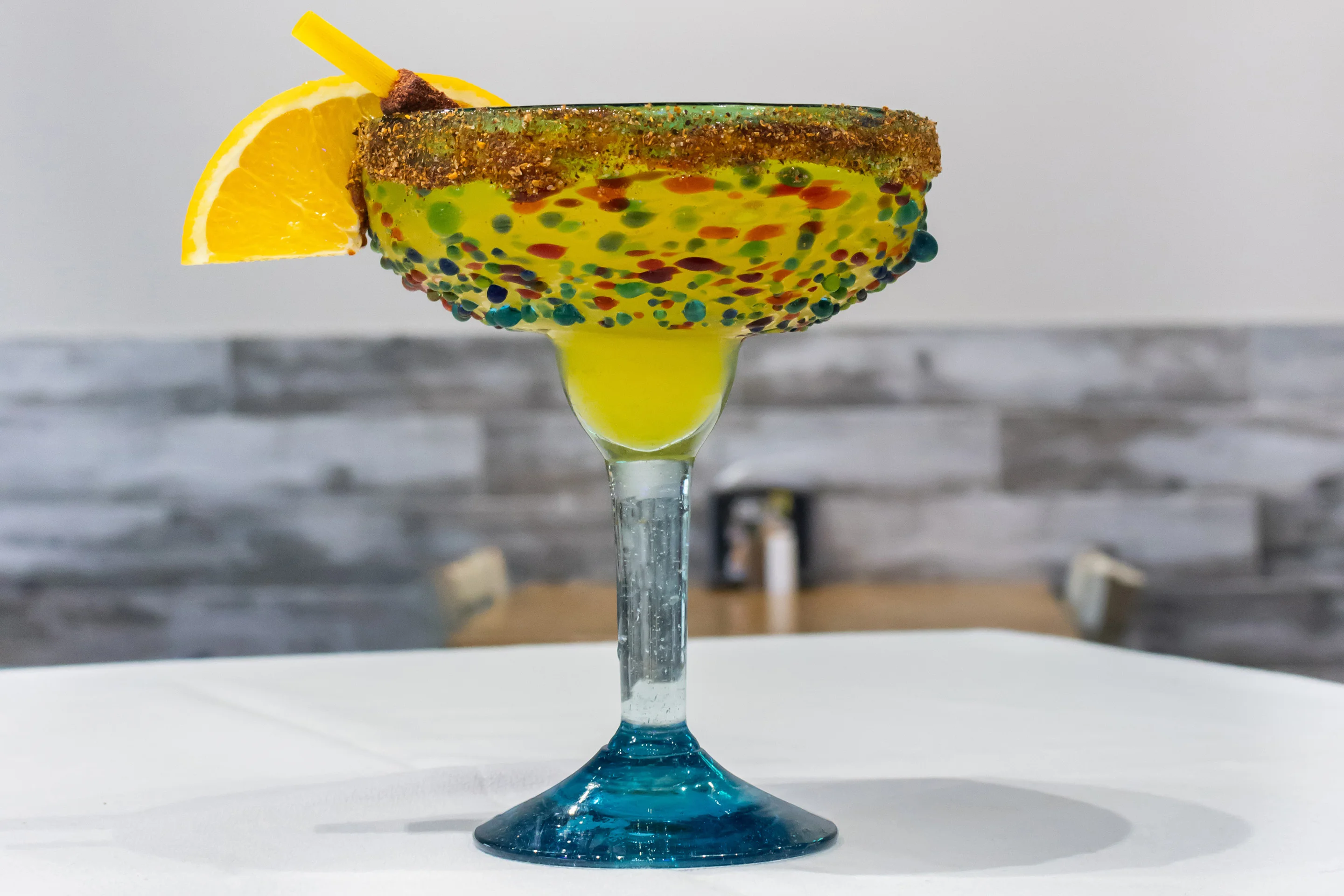 Colorful margarita cocktail with fruit garnish