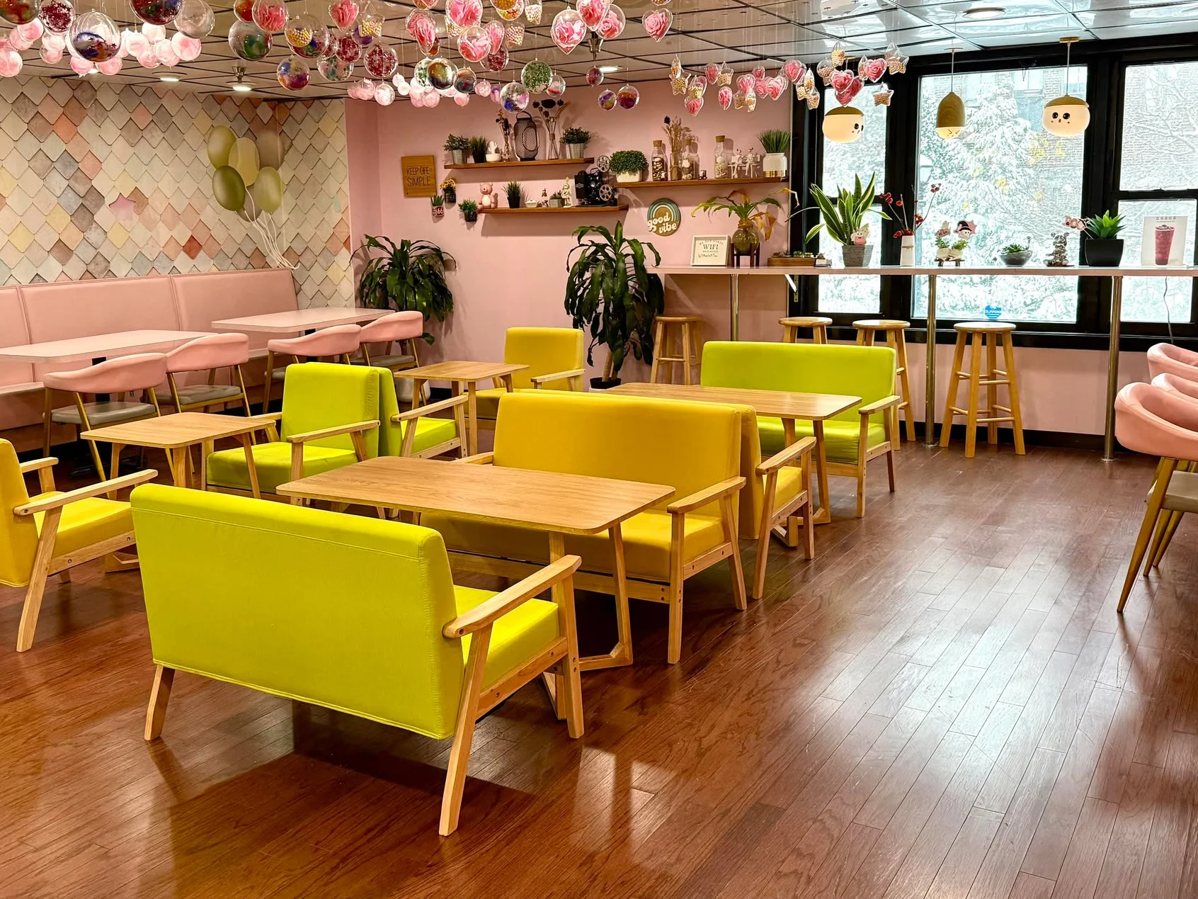 Charming café interior with colorful seating and decorative hanging ornaments
