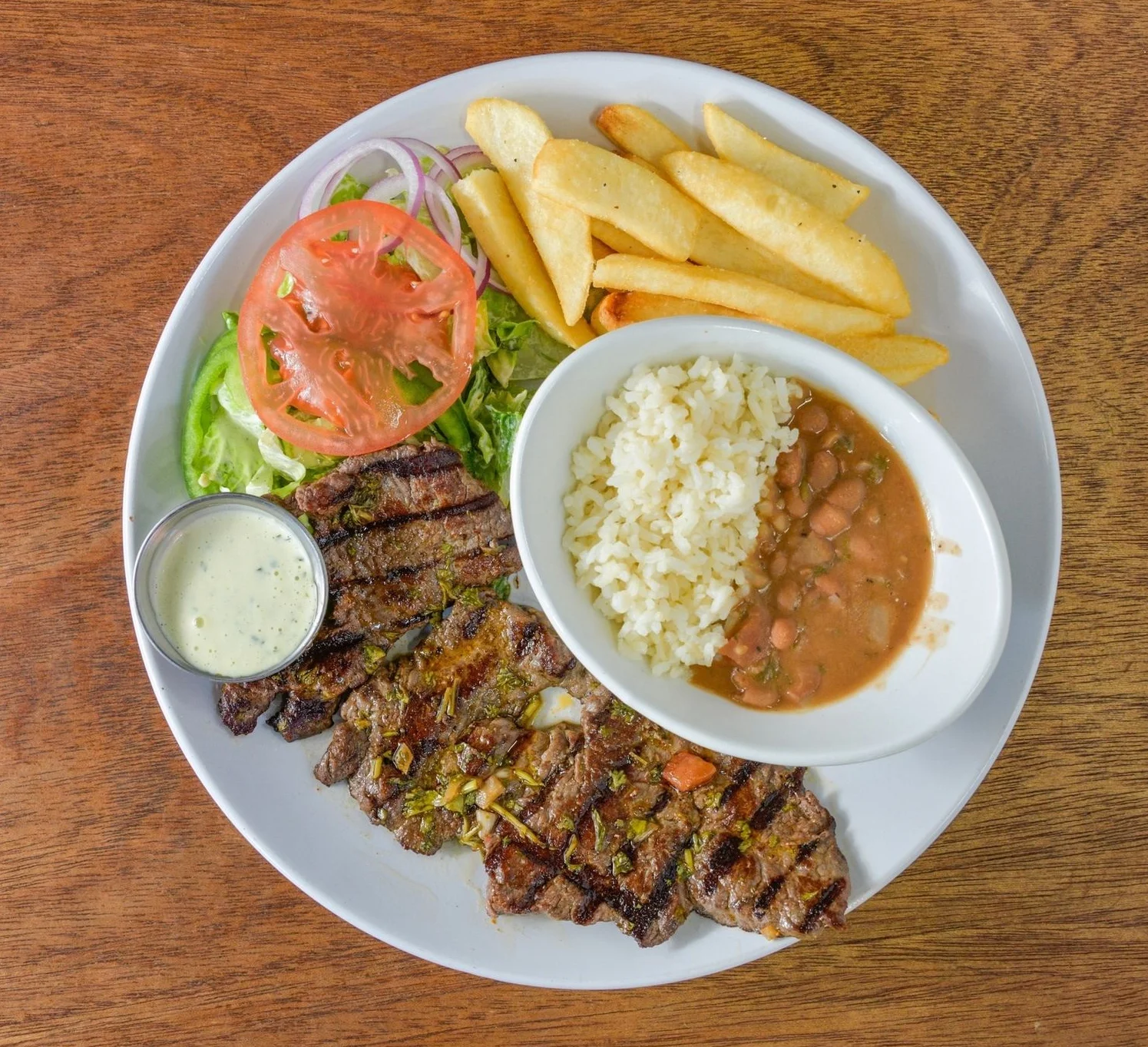 Delicious carne asada dish served with fresh toppings and sides.