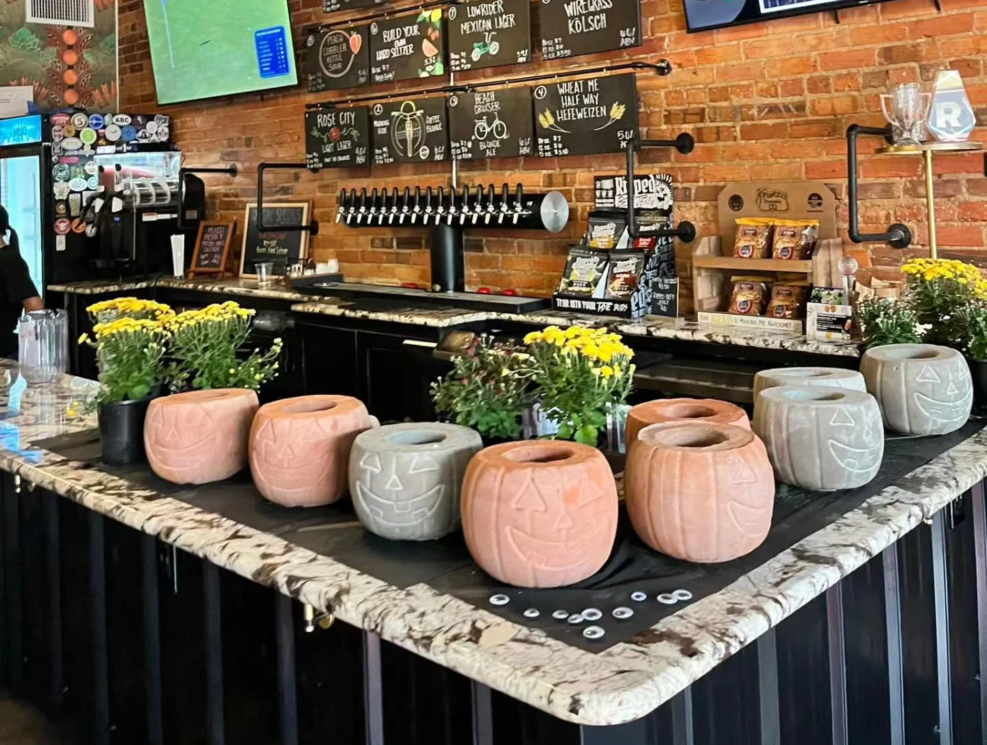 Cozy bar interior with brick walls and decorative planters
