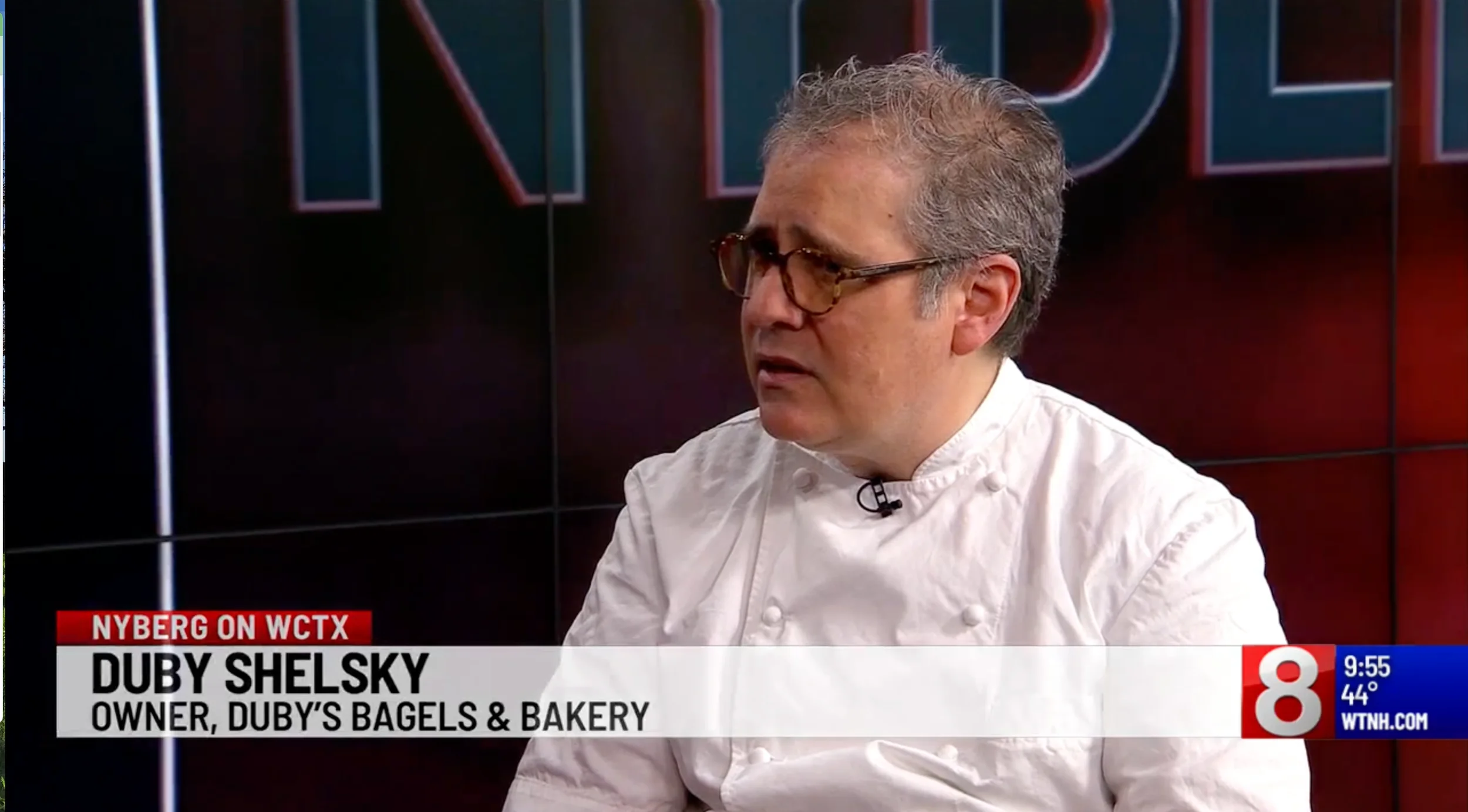 Chef discussing bagel baking techniques on a TV show