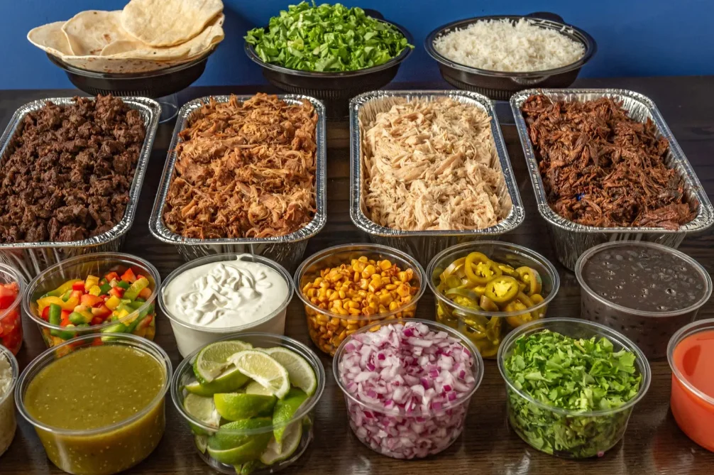 Colorful plate of Mexican tacos with rice and beans