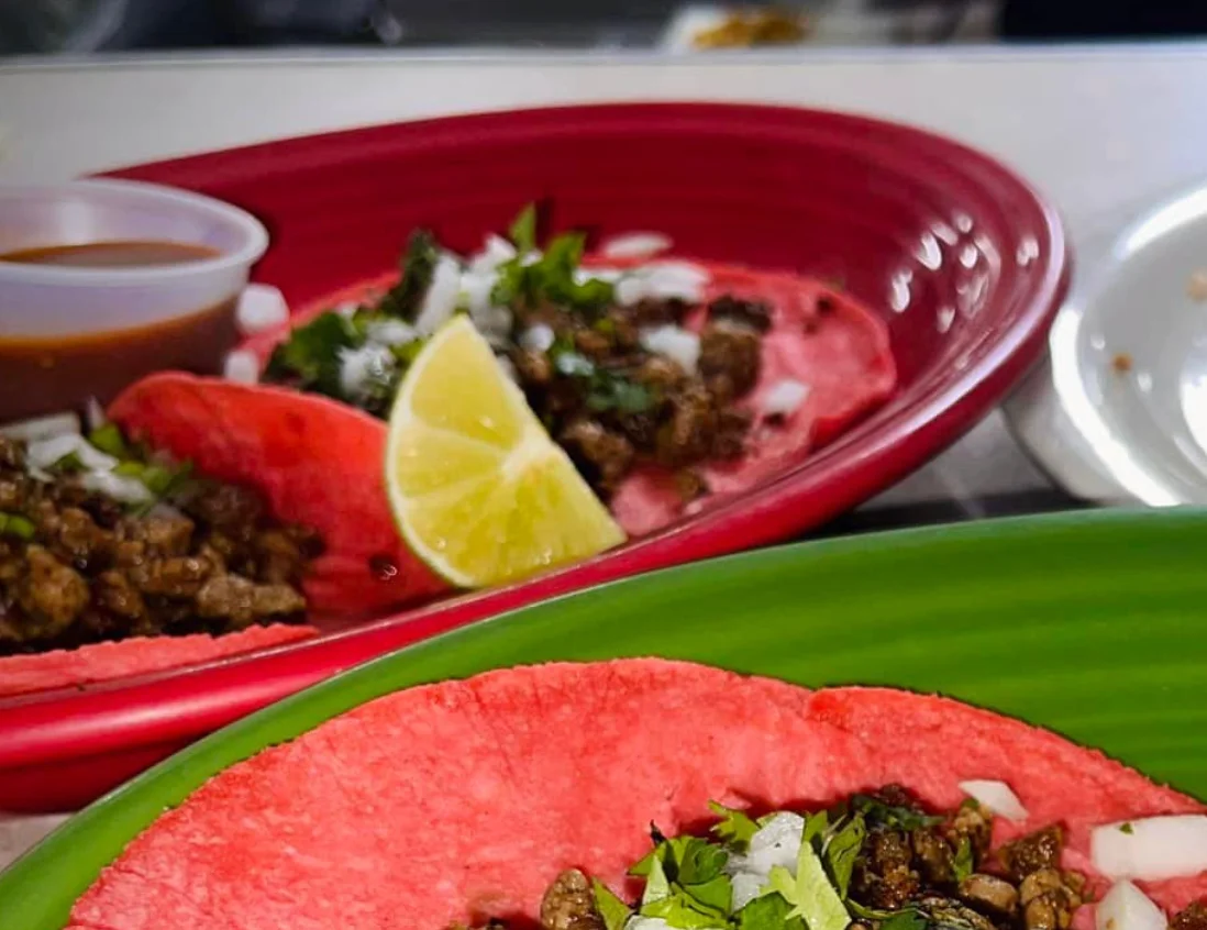 Colorful Mexican street tacos with beef and lime
