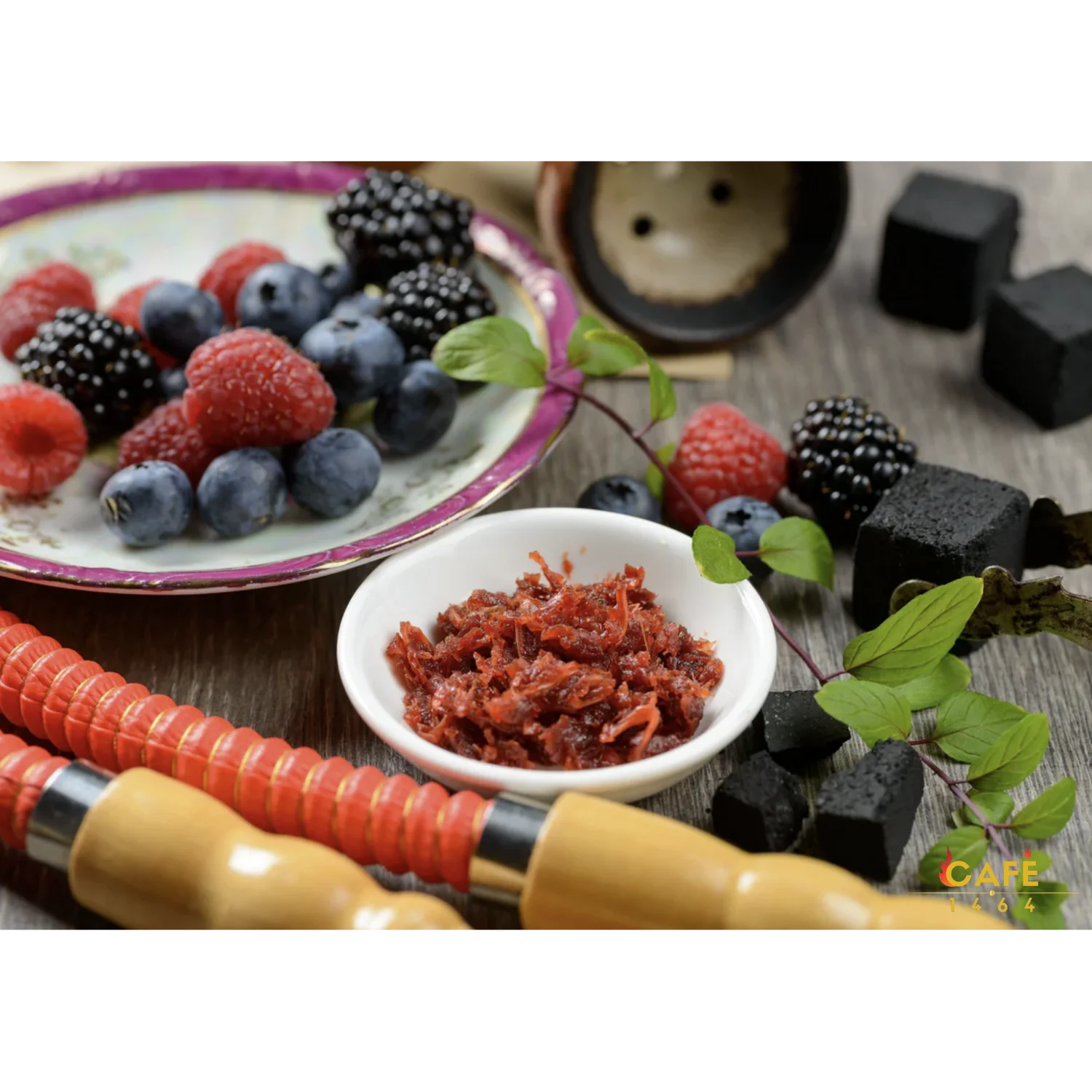 Middle Eastern shisha setup with fresh berries and herbal garnish