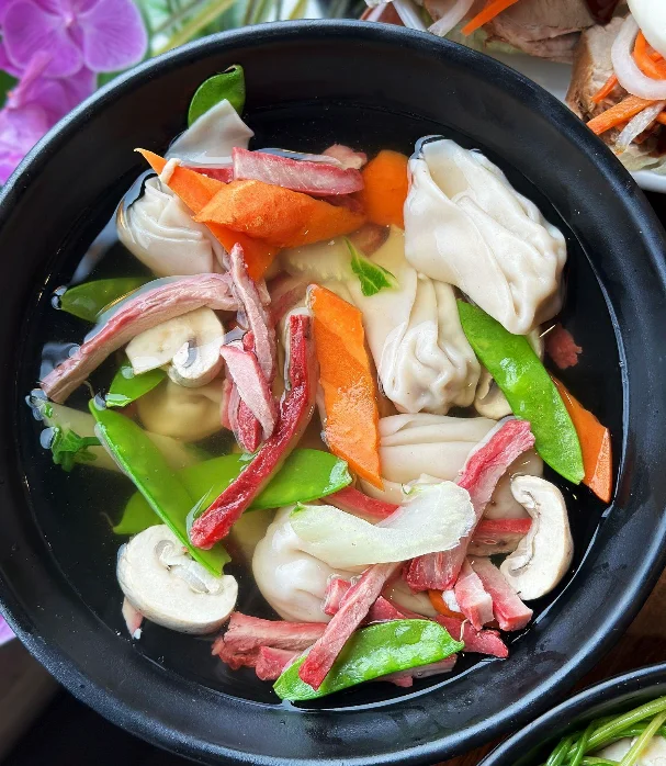 Chinese wonton soup with vegetables and meat
