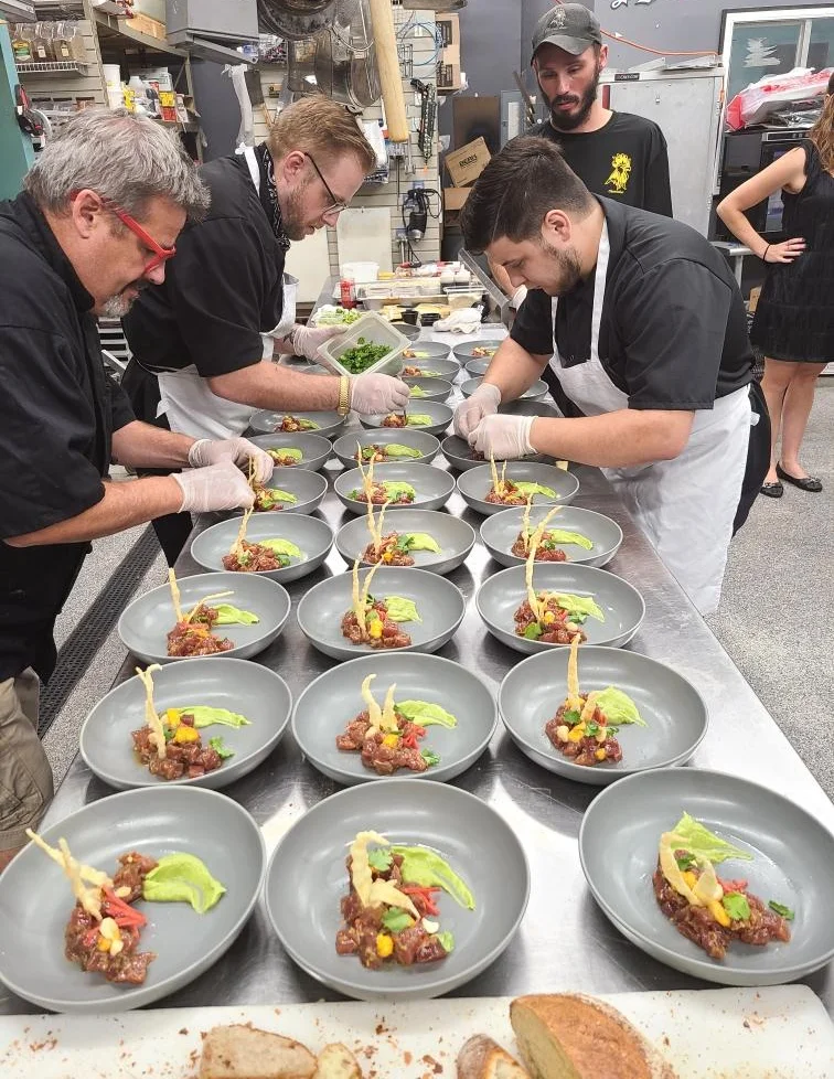 A restaurant chef preparing a dish