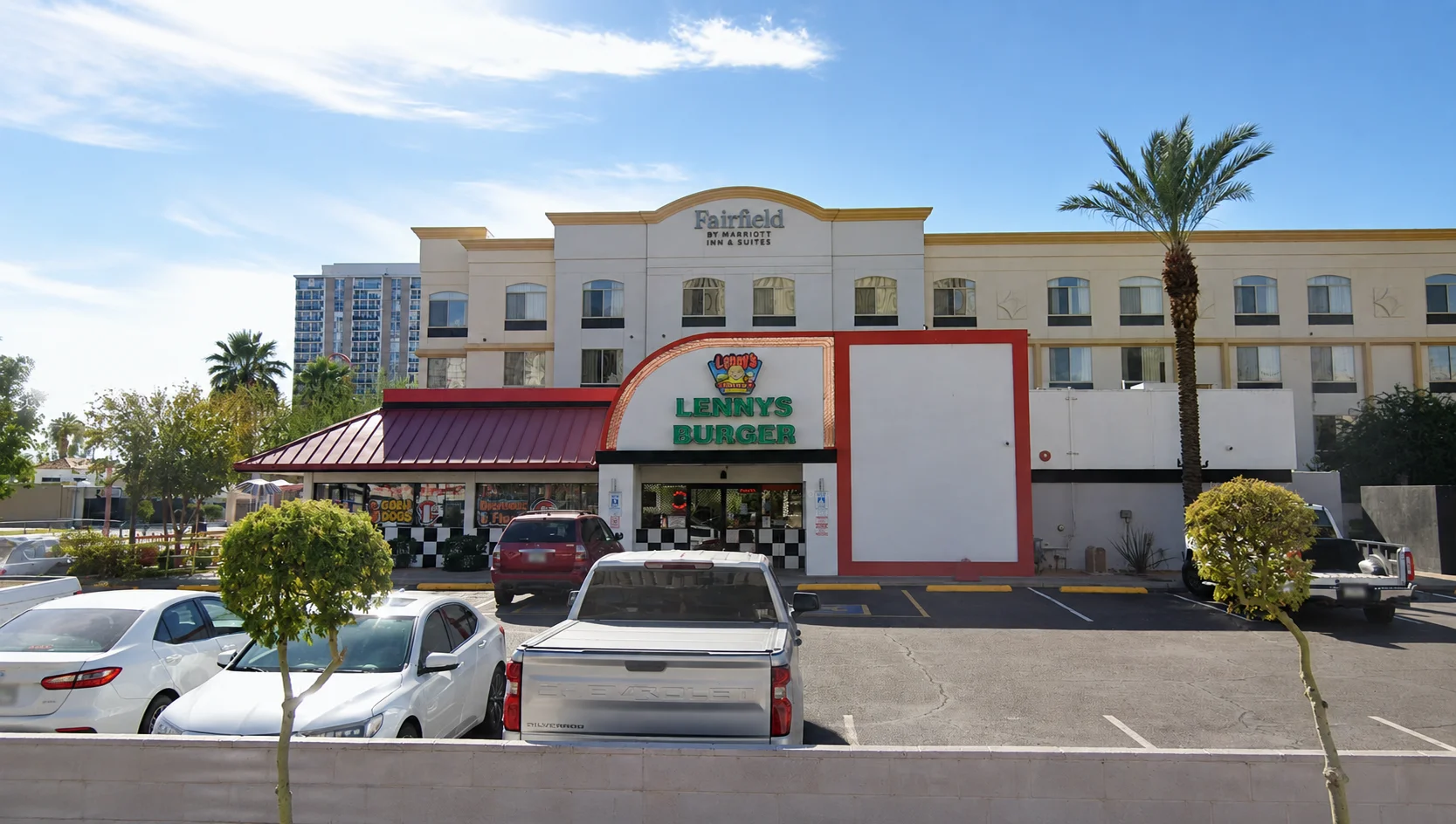 Exterior view of Lenny's Burger restaurant with palm trees