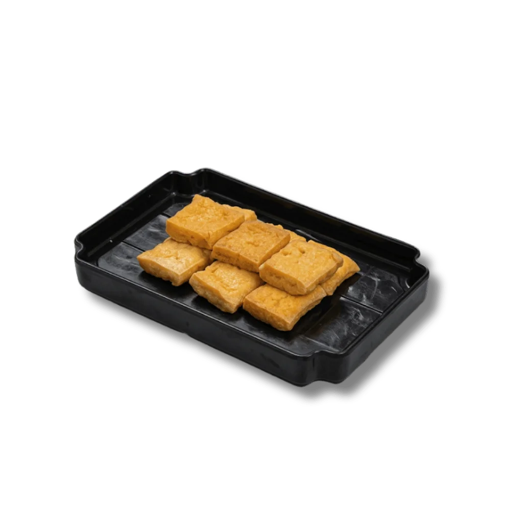 A black tray with rectangular pieces of golden-brown food.