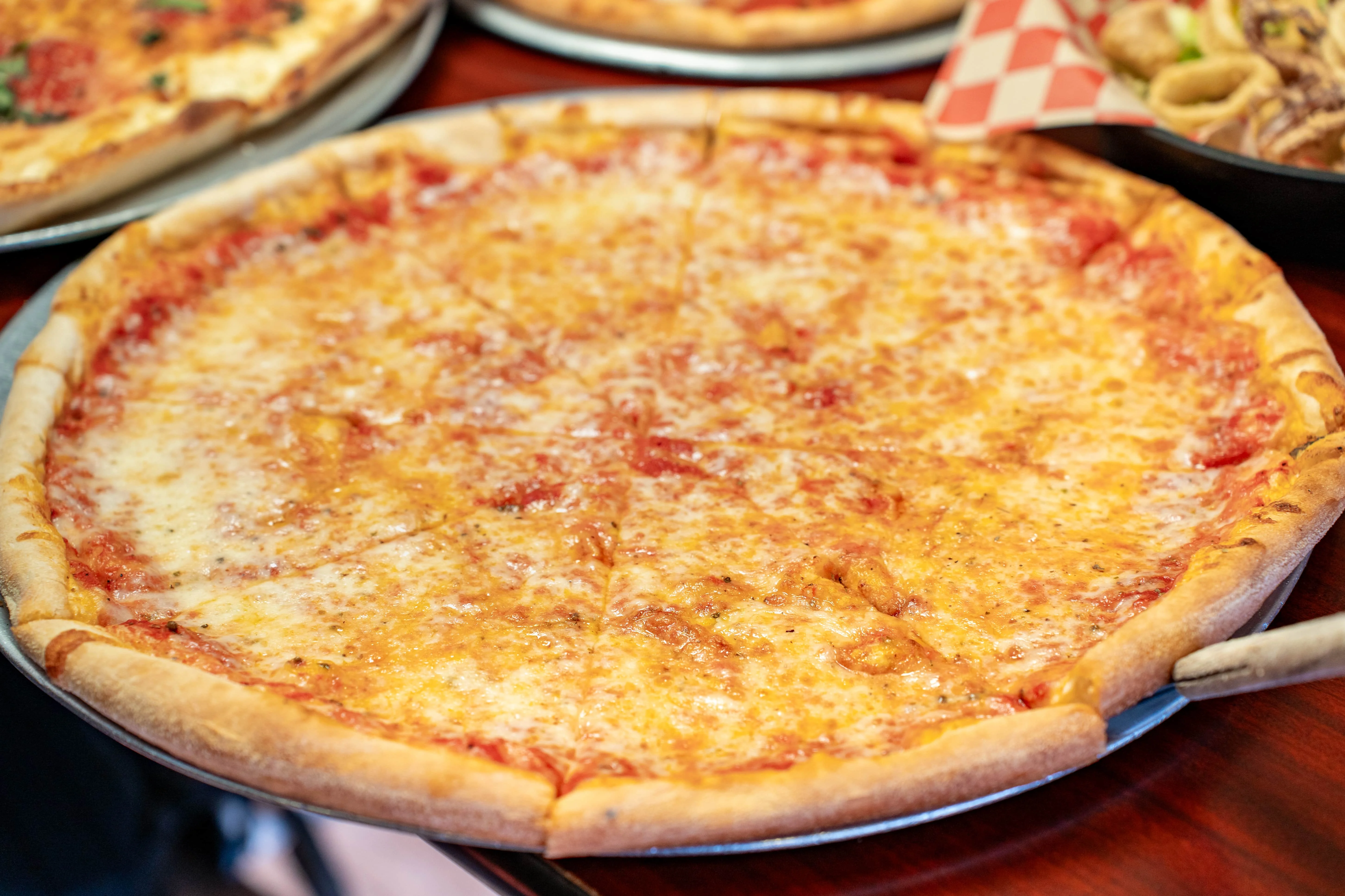 Classic cheese pizza served in a pizzeria