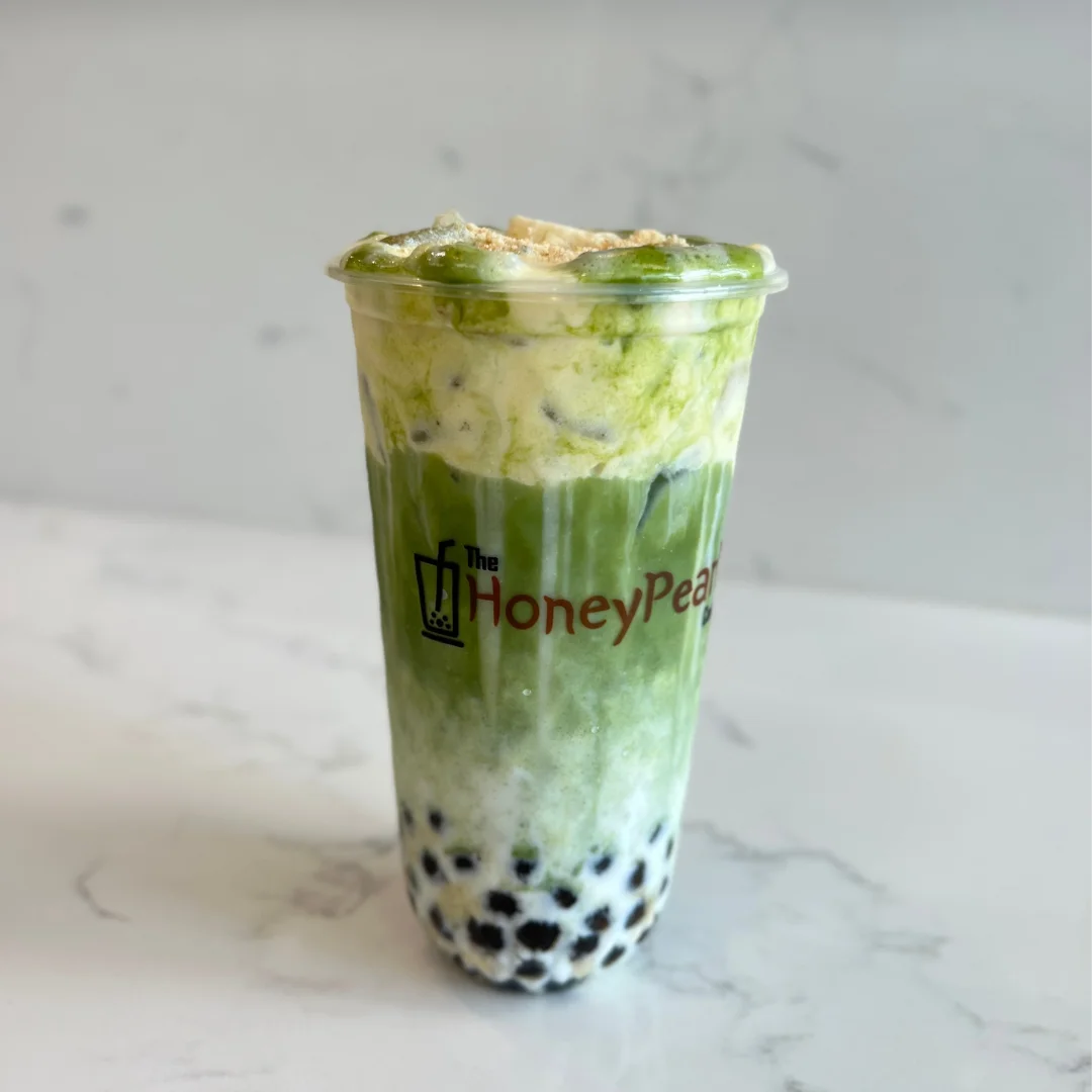 Matcha latte with boba and whipped cream