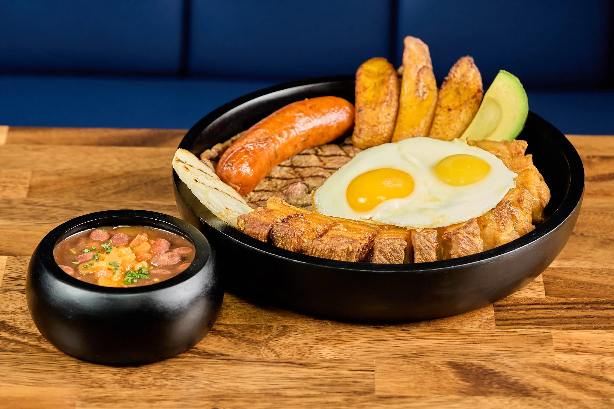 Colombian bandeja paisa served in a traditional bowl