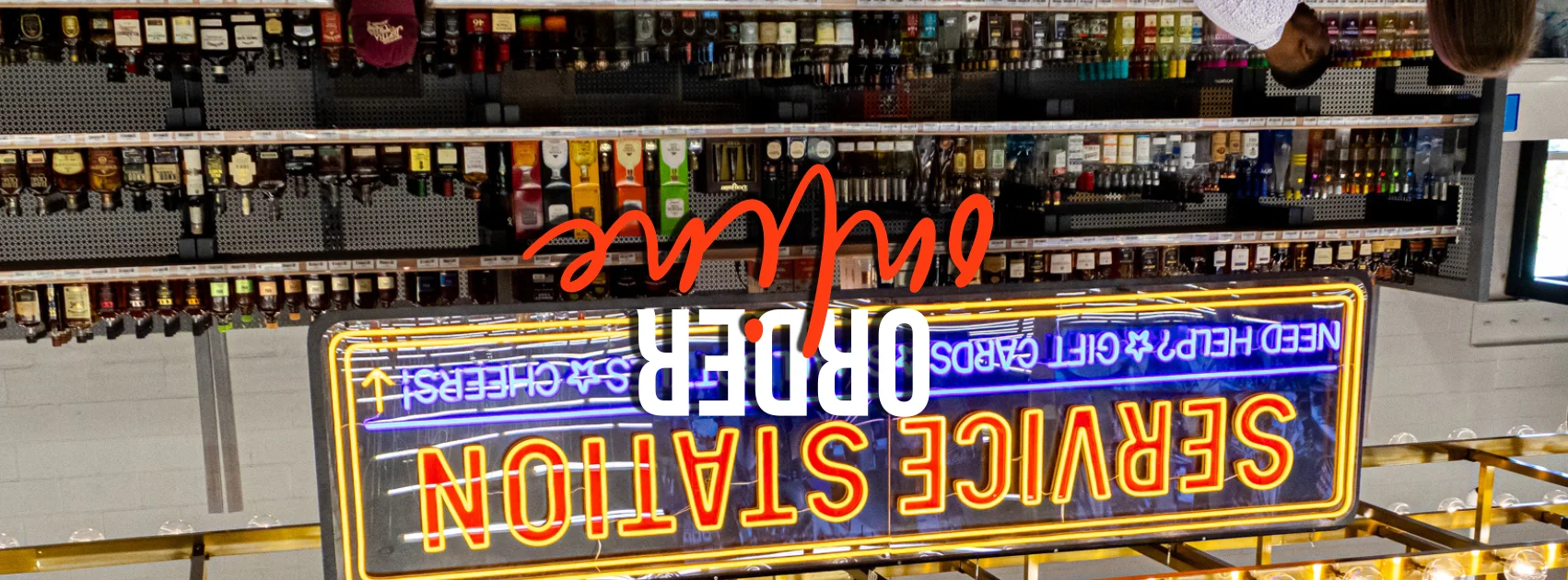 Service station with liquor shelves and neon sign
