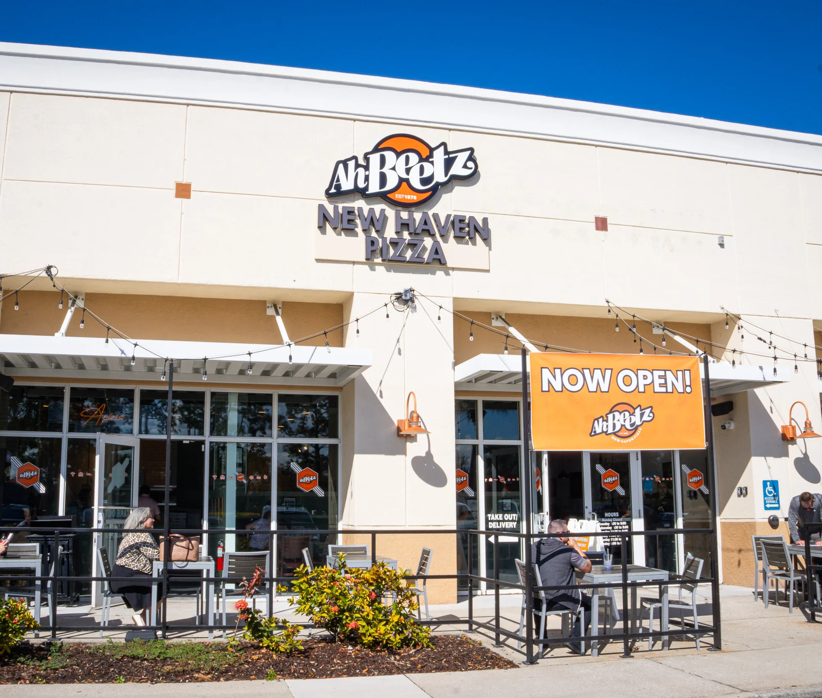 Exterior of Ah Beetz New Haven Pizza restaurant with outdoor seating