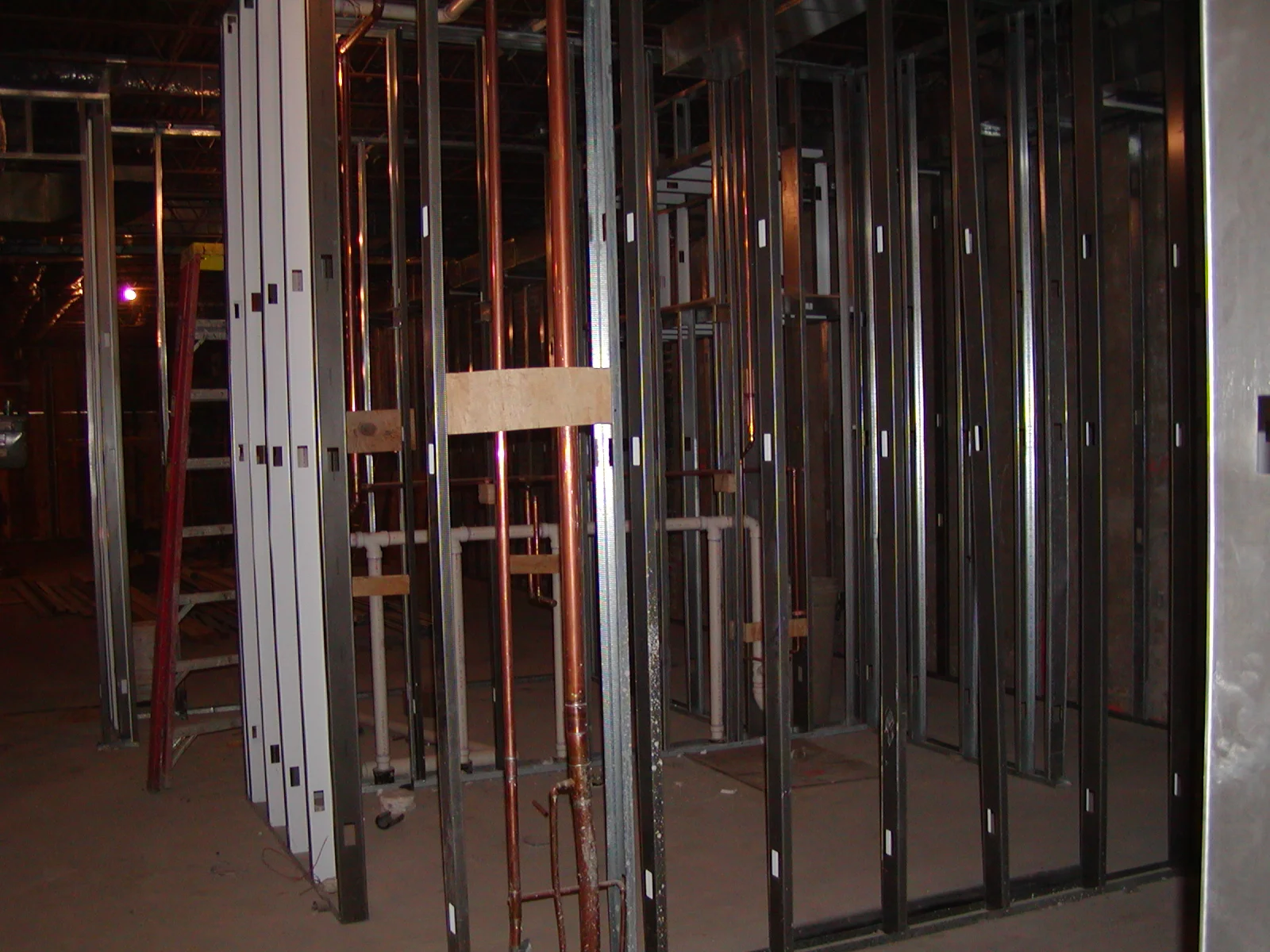 Construction site with metal framing and plumbing installations