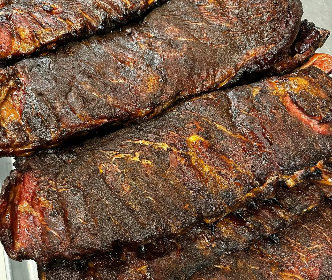 Smoked beef ribs with a rich, dark crust