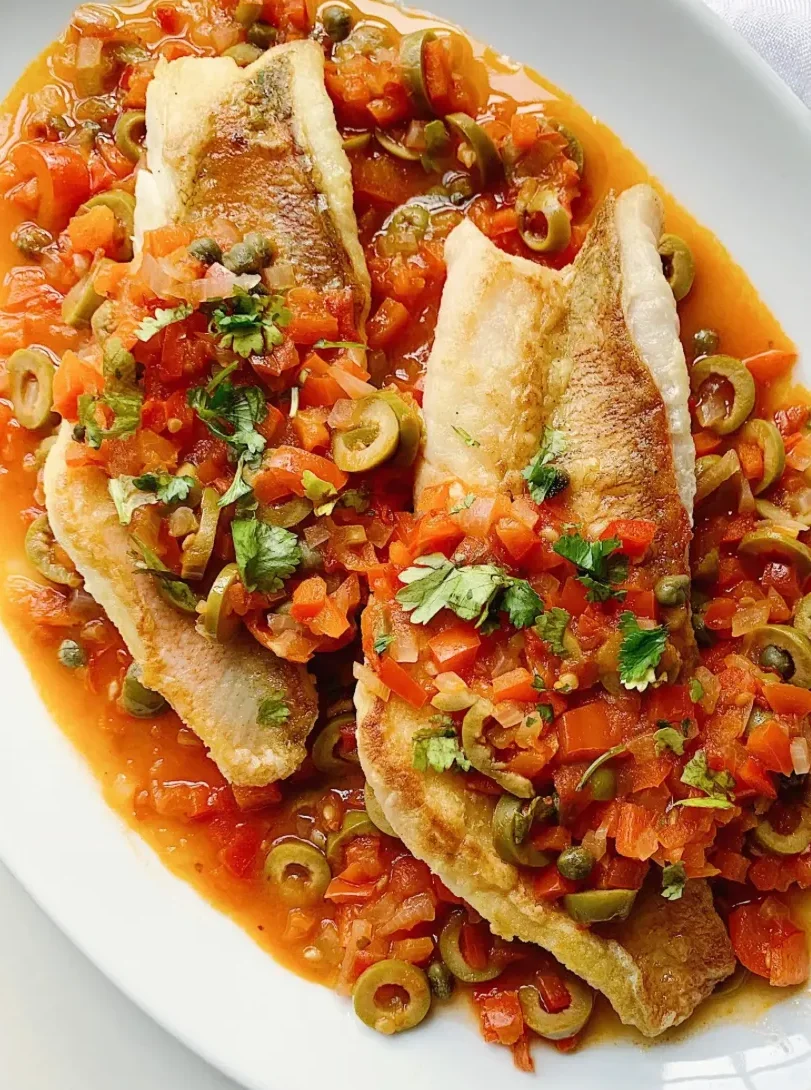 Pan-seared fish fillet with tomato and olive salsa