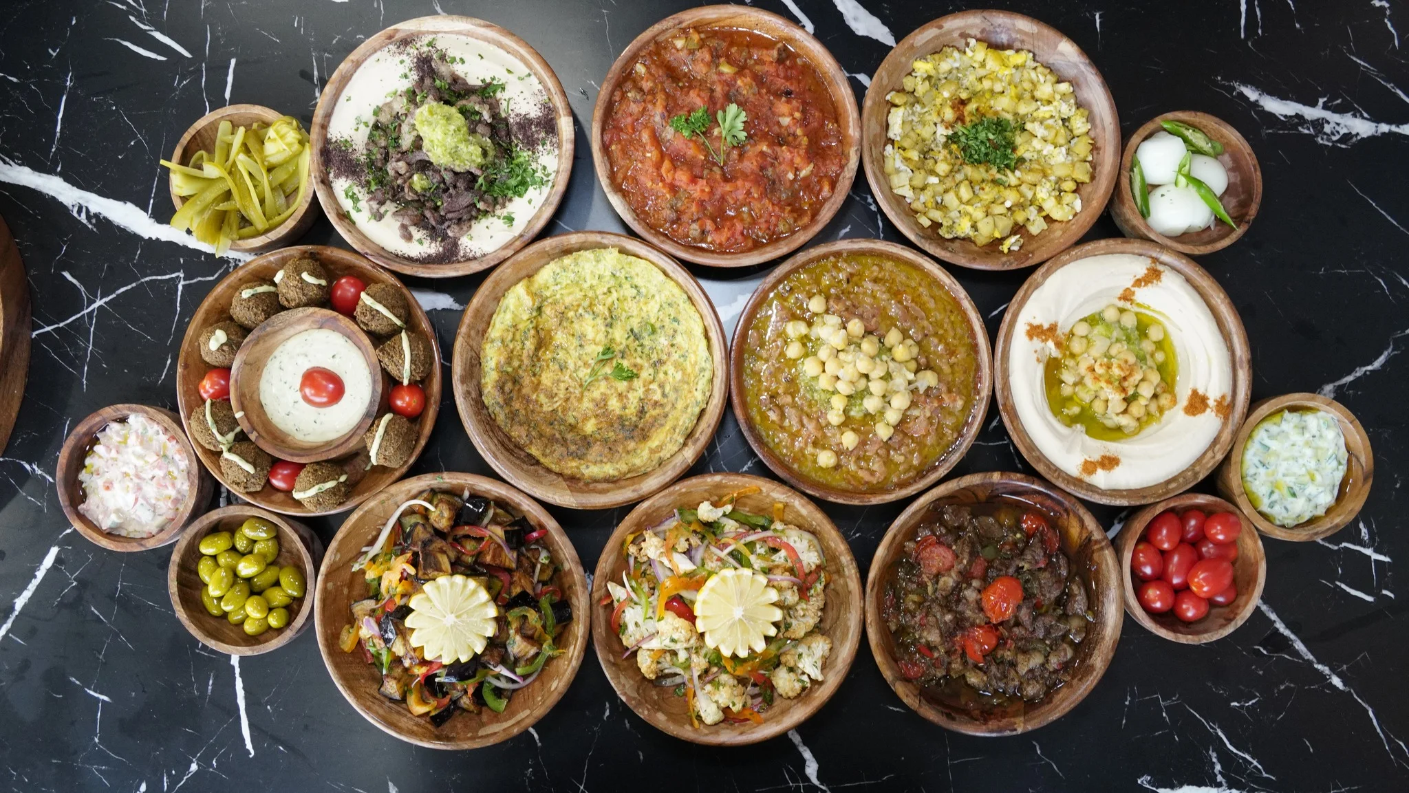 Assorted Middle Eastern mezze platter with hummus and falafel