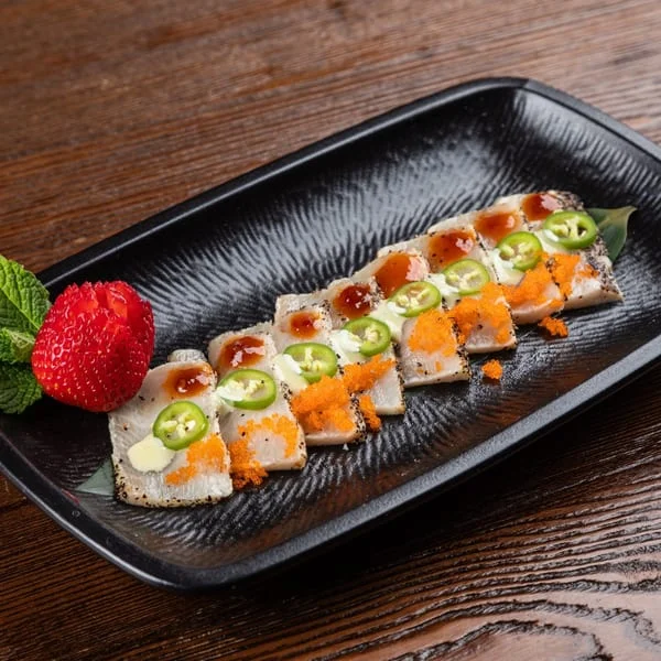 Japanese sashimi platter with fresh fish and garnishes